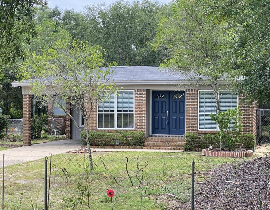 Buyer's loan fell thru, back on the market & Seller said ''SELL IT''.  Less than a mile to Eglin east gate.  A Block from Toms Bayou.  This 3/2 has had many updates.  New flooring though out, Updated bathroom, new entryway.  It is a brick charmer.  A nice wooded DOUBLE lot, covered carport.  This home is loaded with charm.  A must see. Does need some TLC