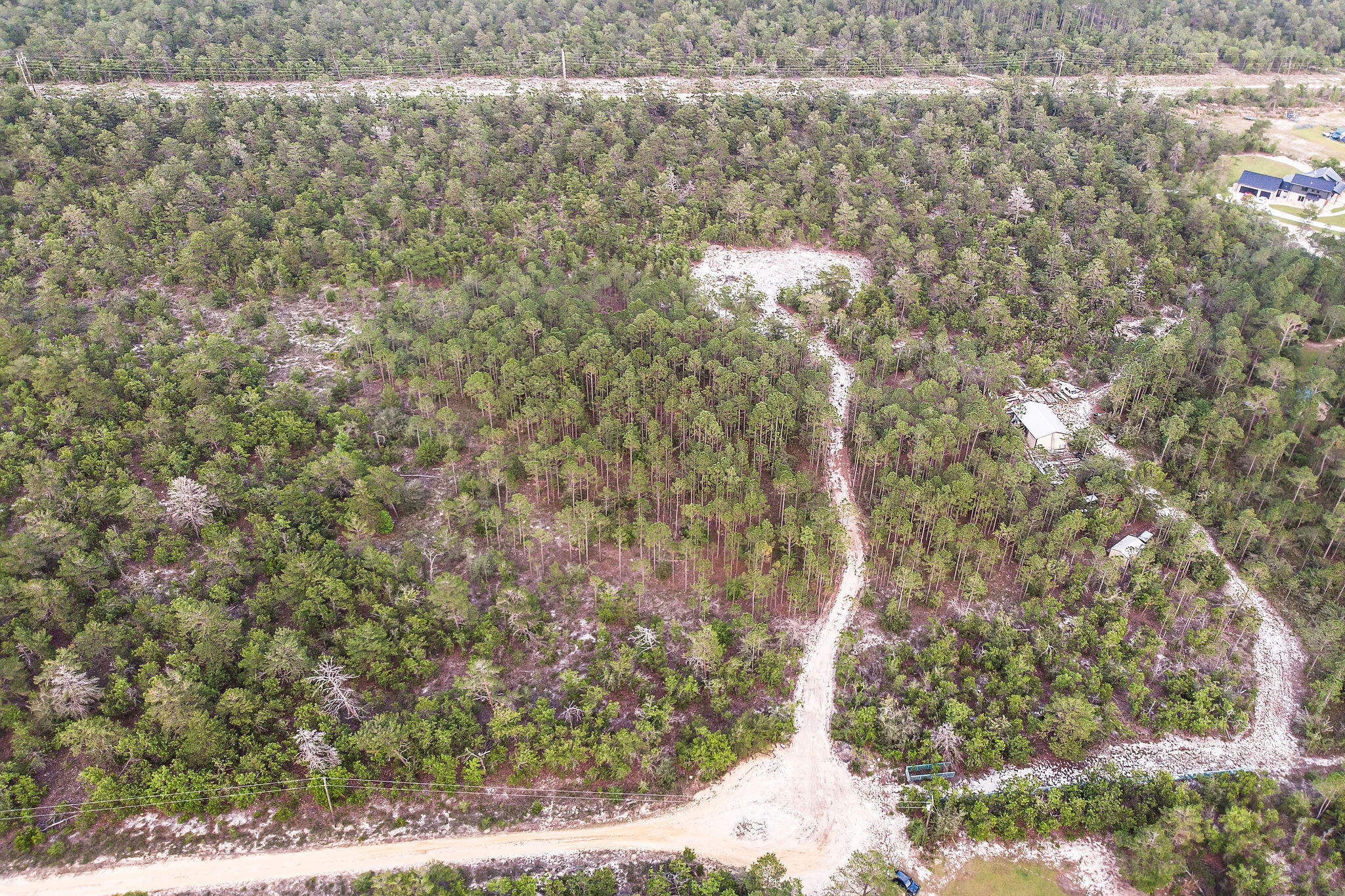 Introducing a prime opportunity to turn your dream home into reality with this expansive nearly 5 acres of vacant land in Freeport, FL. Situated in a sought-after location, no HOA, minimal build restrictions and PRIVACY this property offers the perfect canvas for building your dream home. This picturesque land spans across 4.69 acres of partially cleared space providing the ideal blend of nature and accessibility. Surrounded by lush trees, you will find yourself immersed in tranquility and natural beauty. The partially cleared area provides a head start for your construction plans while preserving the integrity of the environment. A local lender offers options starting at only 5% down payment on land loans with no requirement to build! Reach out to agent for more information Boasting ample space for designing the perfect home, whether you envision a cozy retreat or a spacious family residence, the possibilities are endless.
This area presents numerous advantages for prospective homeowners. Immerse yourself in the charming community and enjoy the nearby amenities, including shopping centers, dining establishments, and recreational options. The acclaimed Freeport Schools are also within easy reach, ensuring an excellent education for your children. For nature enthusiasts, the nearby Emerald Coast beaches and state parks offer limitless opportunities for outdoor adventures. Bask in the sun, indulge in water activities, or simply unwind amidst the breathtaking landscapes that surround you. This vacant land offers the potential for a captivating lifestyle in an idyllic community. Don't miss out on this incredible opportunity to build the home of your dreams in Freeport, FL. Secure your future today and make your dreams a reality. Contact me for more information and embark on a journey towards homeownership and a lifetime of blissful living.
Sellers have invested thousands of dollars with clearing area for large home and long winding driveway, soil tests, permitting and more! This space is teed up and ready to go for its next owner to build! Utilities available at the street, septic permit in hand.