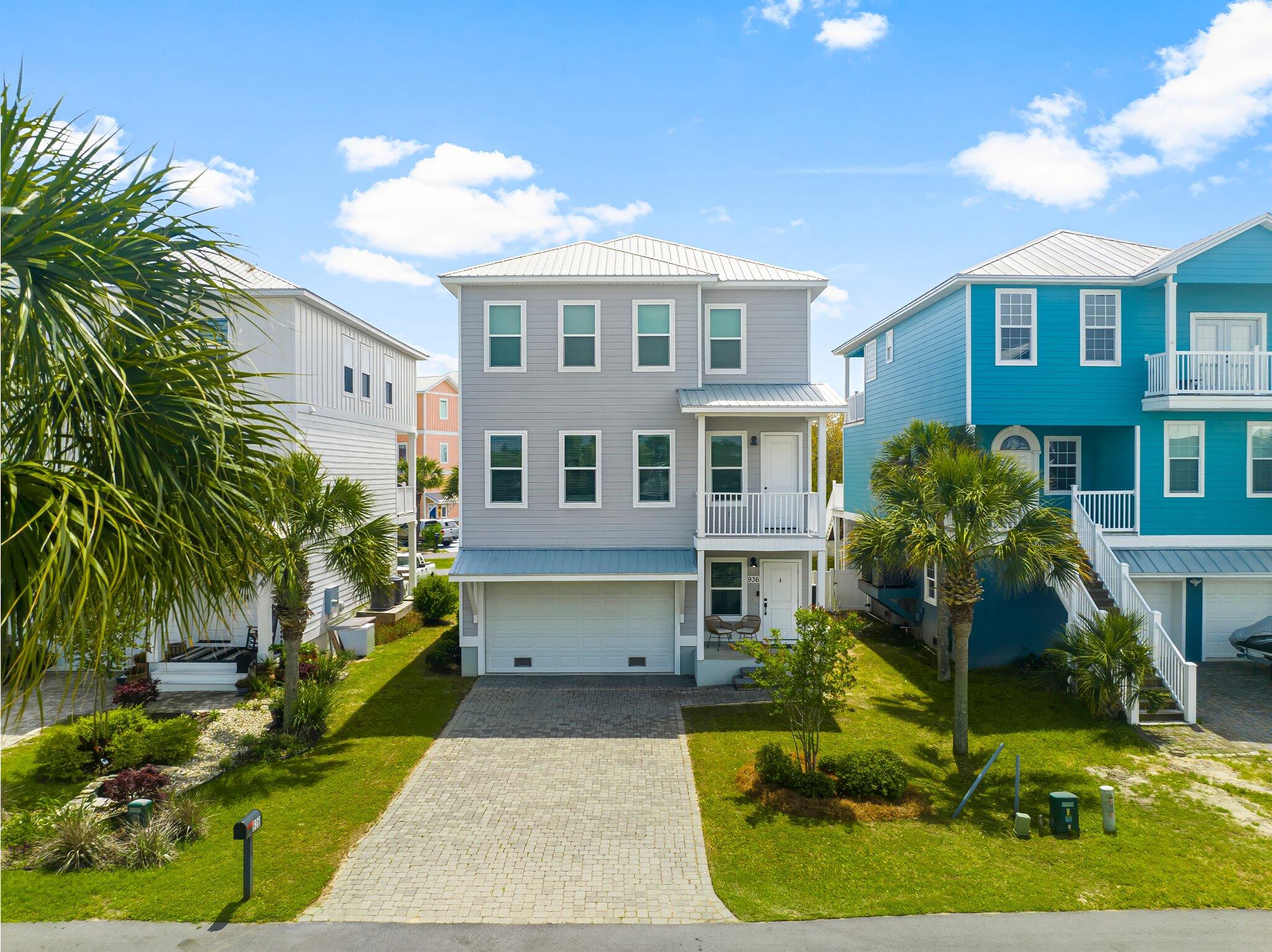 Coastal living meets comfort and style at 936 Lighthouse Lagoon Ct! This 3 bedroom, 2 bathroom beach-style home is nestled in the gated community of Harbour Village Cove and offers the perfect mix of space, function, and waterfront views from your front porch and patio.The first floor features a 2-car garage plus a bonus workout room ideal for a home gym, hobby space, or extra storage.On the second floor, you'll find an open concept living and kitchen area featuring a large kitchen island, perfect for entertaining or family gatherings. This level also includes a flexible bonus room for an office, playroom, or guest space. Step outside onto your second-floor balcony a great spot to enjoy your morning coffee or evening breeze.The third floor is home to all three bedrooms, in cluding a spacious master suite with a walk-in closet, double vanity, and stand-in shower. Two additional bedrooms and a full bath provide plenty of room for family or guests.
Out back, the back yard is perfect for pets or play. The front porch offers relaxing outdoor spaces with peaceful canal views just across the street.
Located just minutes from the beach, this home offers easy, breezy coastal living in a private, gated community.