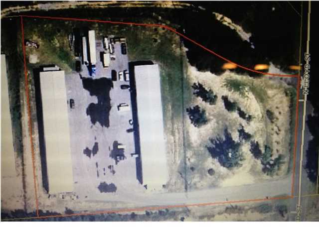 WHAT A BUY! Long term leases in place!Over 16,000 sqft of WAREHOUSE/FLEX SPACE on 3.1 Acres located right in the heart of Crestview! Whether you are looking for a large warehouse complex to occupy your business, or you want to occupy part of the property and lease the rest, there are so many possibilities for this property. The property is fully fenced for security and privacy. There are 2 metal warehouse buildings with 8 separate 1000 sqft units each, for a total of 16 leasable units. All units feature roll up doors as well as walk doors. Right around the corner from Main Street, this property is very conveniently located. Call list agent to arrange a private showing.