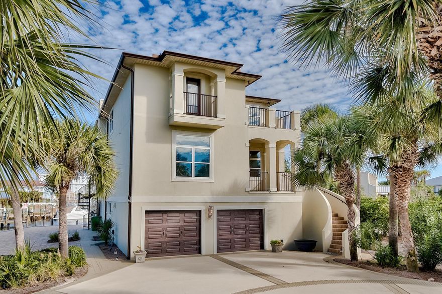 Welcome to paradise! This 3 story home on Destin's harbor is an owner's dream. Featuring 4 deep-water boat slips, 2 of which can accommodate up to 28,000lb, easy access to the gulf and a private dock, it's a haven for fisherman and boating enthusiasts alike. If fishing isn't your forte, you can enjoy the relaxing lifestyle of coastal living in the rest of the home; 5br and 4ba can be found inside, along with a separate apartment on the 1st floor for guests or family. The open floor plan is perfect for entertaining or spending quality time. Located near Harborwalk's favorite attractions, Destin's best shopping, amazing dining experiences and beaches, you won't find a better home in the panhandle. Whether you're looking for your forever home, or an investment, this is the perfect choice!