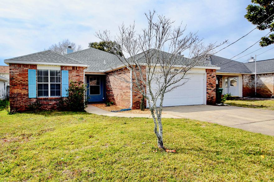 Great home in a wonderful neighborhood with close proximity to Hurlburt Field, Mary Esther, and Fort Walton Beach. This home has many new features including new vanities, mirrors, and lighting in the bathrooms throughout. New carpeting has also been added to one of the guest bedrooms. The kitchen features stainless steel appliances, solid surface countertops, and tile flooring. The back yard is complete with a detached storage shed. The home features a 12.9 x 12.1 covered back porch, which leads tofenced in back yard, with abundant space to utilize and enjoy! Glass window panes currently being updated!. Come home and cozy up to the wood burning brick surface fireplace in your spacious new living room!