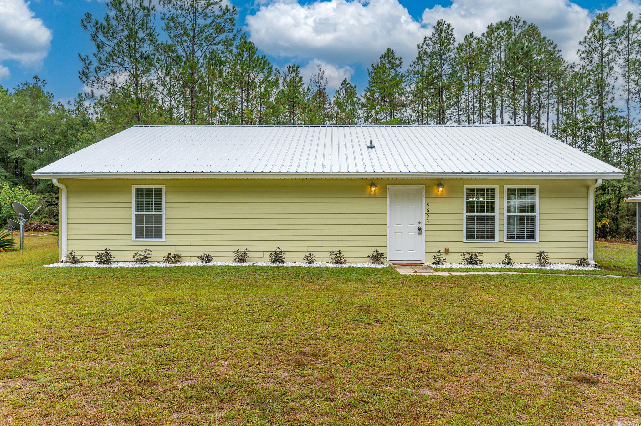 This 2-bedroom, 2-bath retreat features comfort and style. With many recent upgrades, including new carpet, a new roof, fresh paint, and a brand-new screened-in porch, this property invites you to embrace the essence of modern country living.