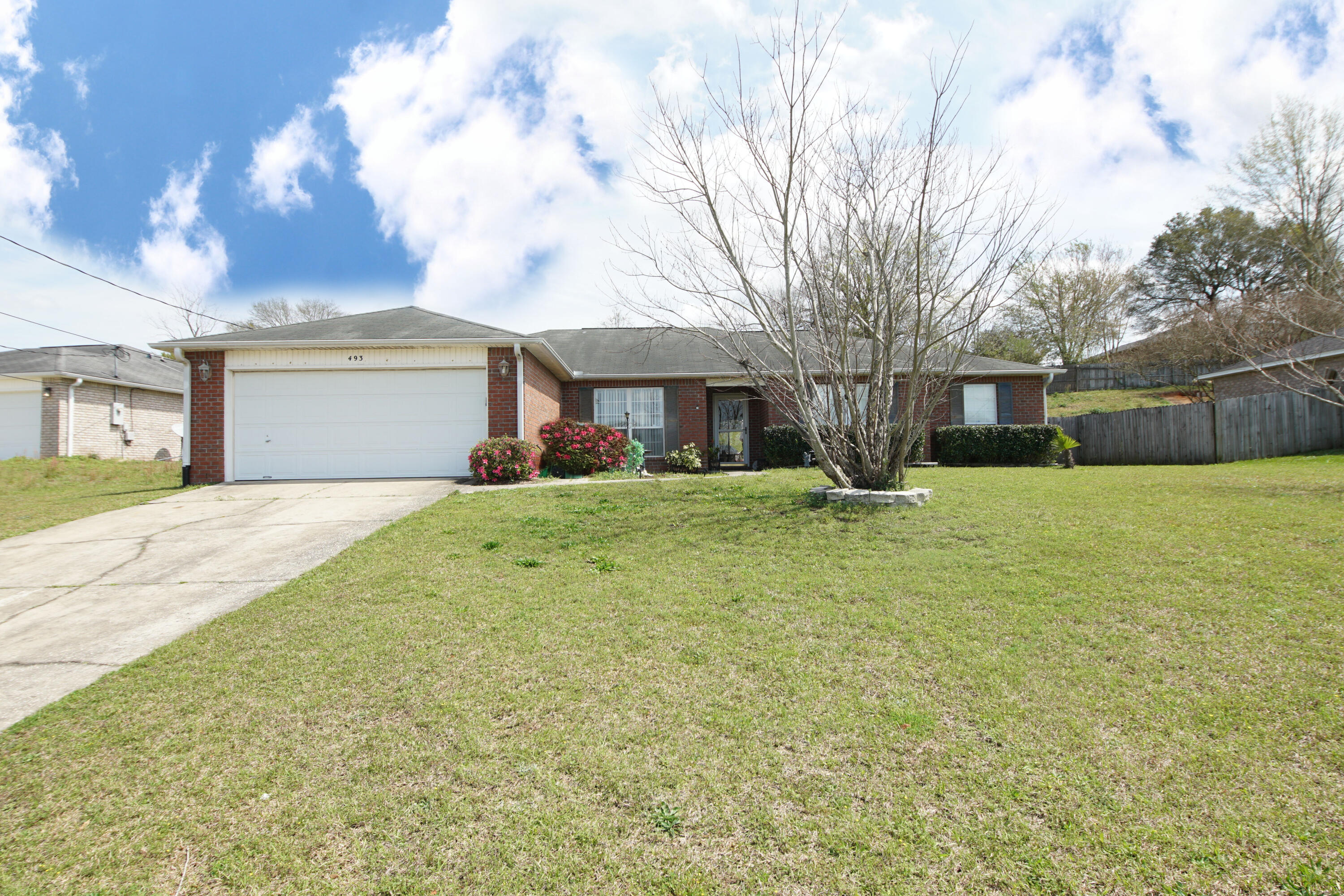 This home features a large, open, and bright 4 bedroom and 2 bath floorplan that is perfect to call home. It is easy maintenance with brick exterior and vinyl soffits. It can accommodate any large gatherings and those frequent guests to entertain. As you enter the foyer you are welcomed with a large family room that features a fireplace for those cool evenings and a mantel to display all your treasures and to enjoy decorating during holiday decor. It is also accented with vaulted ceiling and shelf accents to display your favorite family heirlooms. This kitchen is complete with a stove, microwave, dishwasher, refrigerator, and kitchen island to streamline mealtime and preparation for those busy mornings or holiday meals. It has a pantry and plenty of cabinets. It has an eat-in