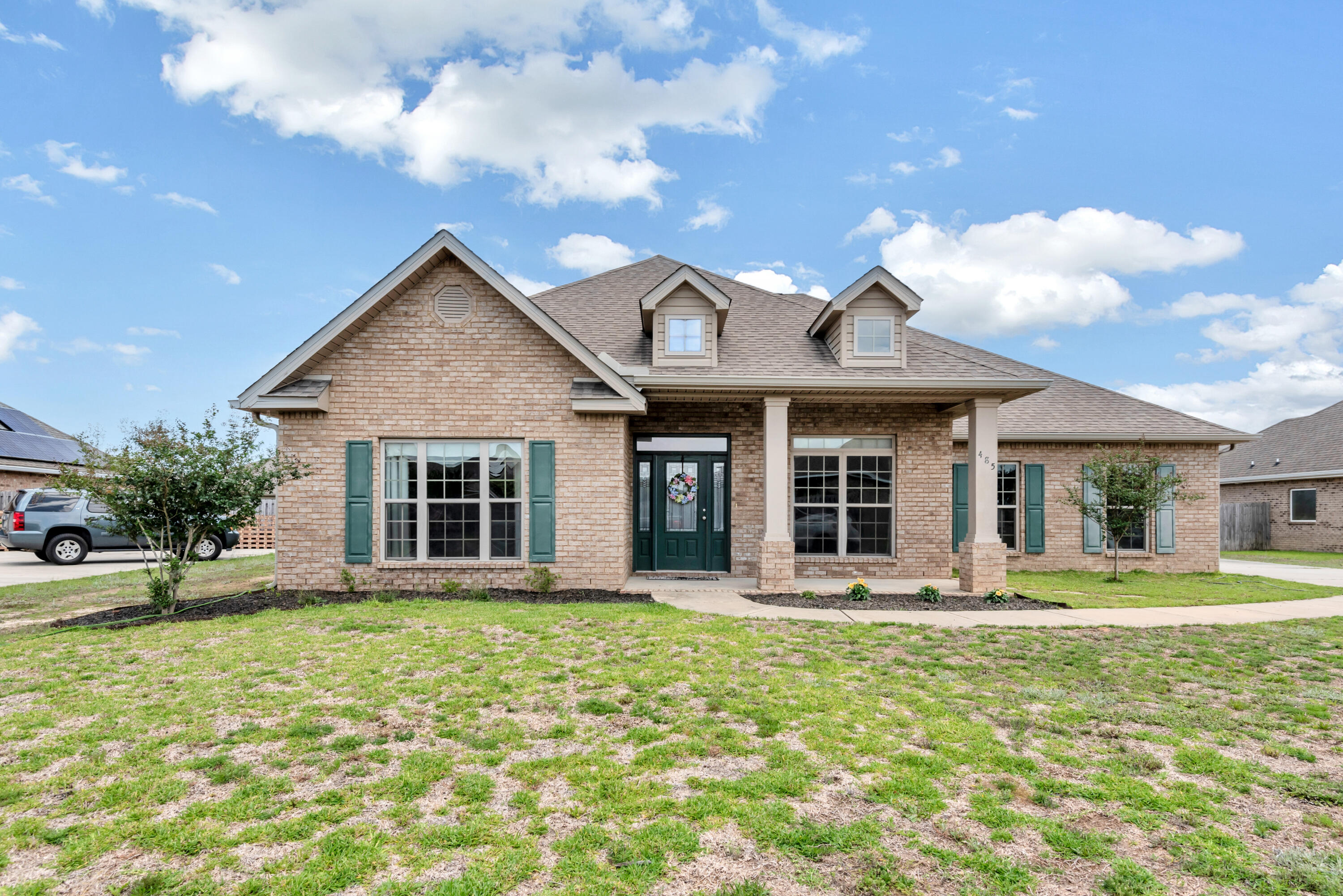 Upon entering this One Owner McKenzie home your eyes are immediately drawn down the Grand Foyer to the Great Room featuring a high ceiling with double trey, carpet and large windows opening to the covered patio and fenced back yard beyond. The open floorplan allows the kitchen with a large island as well as large pantry to flow into the Great Room. The master suite is ideally placed off the Great Room and features a trey ceiling and separate entrance to the covered patio. The Master suite is truly that featuring a large master bathroom with double sinks, separate shower and separate tub. The walkin closet is huge! The front of the home has a large study / library with built in shelves and a sliding door to close it off for privacy. The dining room is large as well. There is a back hall to the kitchen going past the large pantry and laundry room. There are two bedrooms with a full bath off the Grand Foyer and an additional two bedrooms with a full bath located separately off the Great Room. Redstone Commons features a large community pool, children's play area. The community is located near both the elementary school and the middle school. shopping, restaurants, and medical are nearby for convenience and yet a short drive to many of the nearby military bases.