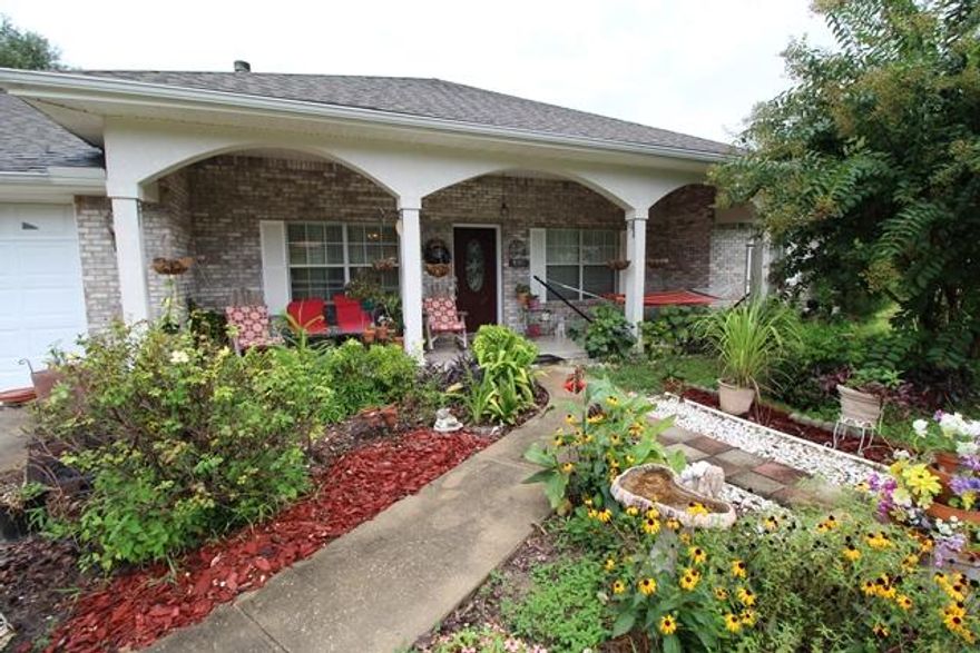 ***Buyer financing fell through...back on the market*****Great home on the North end of Crestview. This home sits on 2 beautiful acres. Features include...all brick exterior, formal dining room, sunroom, eat in kitchen, tile and wood laminate flooring, new carpet in office and bedrooms, fresh paint, security alarm and a huge Jacuzzi tub in the master bath. The front tiled patio is warm and inviting. The living room features a wood burning fireplace. The kitchen is very large with lots of cabinetry and pantry space. This home will not last long as it provides all the comforts of home with the peace and quiet of space.