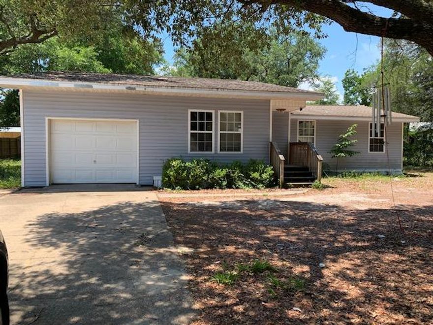 Great location for this sturdy home on a large lot! It is a fixer upper in need of attention, but the kitchen is in in good shape (appliances convey) and the oversized garage has a lot of storage to offer. A half bath could be an option in the laundry area. Some wiring has been updated and the HVAC is only 3 years old.