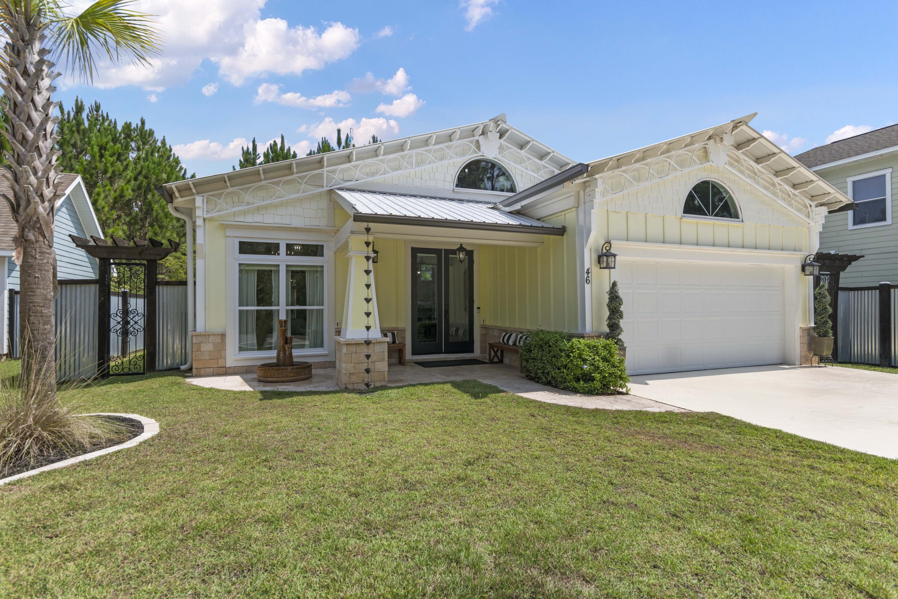 Experience Florida living in this incredible custom home, featuring stunning poplar wood ceilings, three-dimensional epoxy flooring, amazing outdoor space with stone waterfall fountain, metal roof, and 2 car garage.This home is adorned with high end custom finishes throughout, including 8-foot solid wood doors, tall ceilings, iron work on the staircase, and floor to ceiling glass doors and windows.The open kitchen boasts exquisite quartzite countertops, high end appliances and beautiful cabinets. The spacious owner's suite offers unparalleled comfort and elegance with an amazing en-suite bathroom. The secondary bedroom is perfect for your guests.  This home offers a great loft overlooking the living space that is designed for an office or can be used for an extra sleeping space.