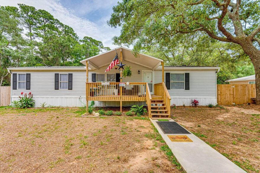 Welcome to this stunningly renovated Gulf Breeze home, perfectly blending modern updates with comfortable living. This 3-bedroom, 2-bathroom, 1,512 sq. ft. residence sits on a peaceful, private lot shaded by majestic Live Oaks, offering both tranquility and convenience near the new Soundside High School. Every detail has been thoughtfully updated--from the new roof and gutters to the inviting front and back porches, sleek wood-look laminate flooring, and freshly painted interiors that create a bright and airy atmosphere. The kitchen is fully equipped with a brand-new stove, built-in microwave, and stylish lighting, making it a joy to cook and entertain. Ceiling fans throughout keep the home comfortable year-round, and the A/C system, only 2 years old, has had ductwork professionally cleaned and partially replaced for optimal performance. Each bedroom boasts spacious walk-in closets, while the master suite offers a luxurious garden tub perfect for relaxing after a long day.

Additional highlights include a 16x10 storage shed in the backyard and ample outdoor space to enjoy the shade of the Live Oaks. This home is ideal for a growing family, first-time buyers, or retirees seeking a serene and move-in ready retreat. With its thoughtful updates, charming character, and unbeatable location, this Gulf Breeze gem won't last longcome see it today and imagine calling it your own.