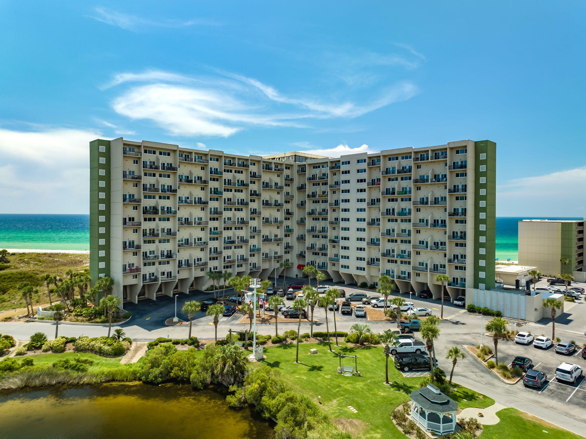 Welcome to your slice of paradise at Pinnacle Port! Nestled in the most coveted wing of this prestigious community, this 2-bedroom, 2.5 bathroom townhome-style condo boasts breathtaking panoramic views down the pristine beach, overlooking Camp Helen State Park, Inlet Beach, Rosemary Beach and 30A on the main floor and views down Panama City Beach and Pier park on top floor. Step inside this updated townhome style condo Large windows frame the stunning vistas, offering daily doses of the mesmerizing beachfront right from the comfort of your condo. The master suite is a serene retreat, complete with its own private balcony access and an ensuite bath for utmost convenience and luxury. The second bedroom also offers comfort and privacy for guests or family members. This exclusive condo comes with a range of amenities, including, boat ramp, boat slips 2 pools, tennis/ pickleball counts, grilling area fitness center, private beach access, ensuring a lifestyle of relaxation and leisure. Pinnacle Port's desirable location provides a lakefront and beachfront property with easy access to Rosemary Beach, Alys beach and 30A's dining, and entertainment options, making it an ideal choice for both a vacation rental machine or a permanent residence. Don't miss this rare opportunity to own a piece of paradise in the most sought-after wing of Pinnacle Port. Embrace coastal living at its finest and make this stunning condo your own!