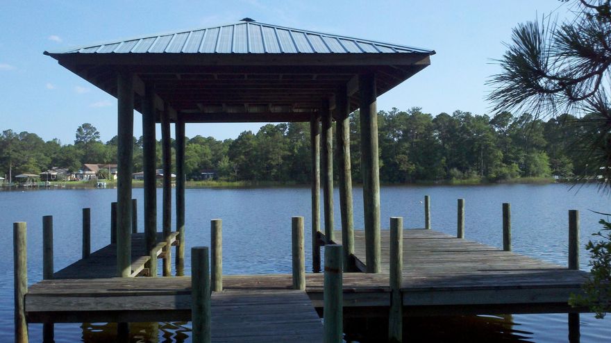 MALLET BAYOU WATERFRONT LOT COMPLETE WITH BOAT DOCK! Ready to build lot with City Water Tap Paid! Level lot is ready for the dream home to begin! Open views on wide area of the Bayou and southerly breezes. Boat dock has covered slip with metal roof and built with Pi-Locks. Lot is 100' in width - not many lots with that width on the water! Easy travel south on Hwy 331 to Hwy 98 or to the north to I-10! Beaches of South Walton only 15 minutes away - Enjoy the Bayou Life and the Beach Life!!