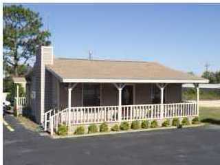 GREAT LOCATION!! Excellent investment opportunity, high traffic for your new office location or rental property. This corner/redlight location has easy in and out for your customers. Large sign available to advertise your business with 4 panel display. A great location for an office or small retail business. Purchase this building & you can rent the front portion of the building which includes 2 office spaces/bathroom/kitchen & the back half of the building can also be rented which has two offices. Many Possibilities! PROPERTY TO BE SOLD ''AS IS'' ***Listing Agent has Interest in Property***