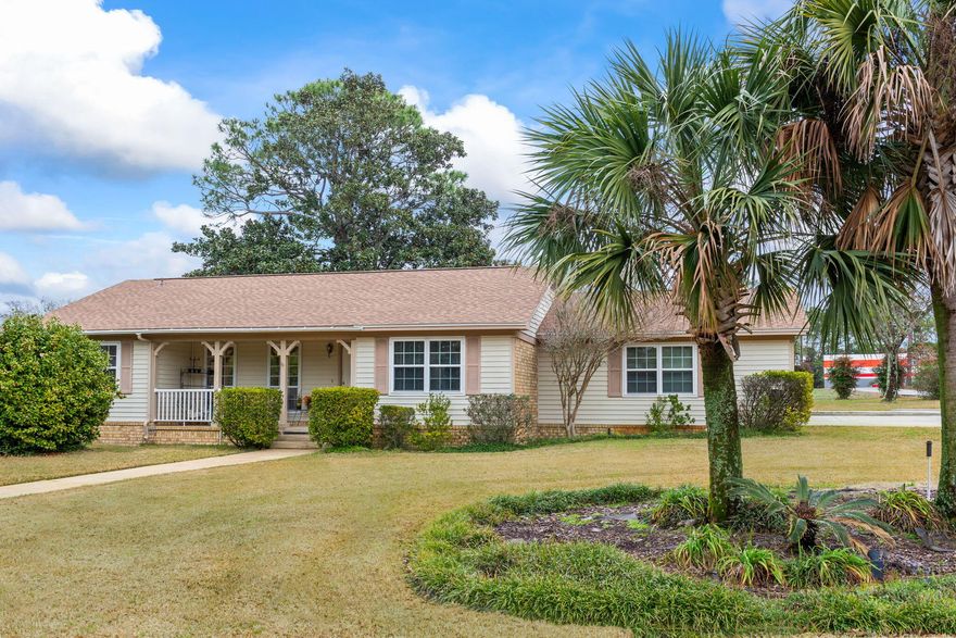 Southern charm with endless possibilities! For all the renovators and visionaries, this charming home is a hidden gem waiting to be polished! With delightful, classical details and its original character, this property offers a unique opportunity to restore it to its highest potential. This home sits on an idyllic corner lot with an extended driveway leading to the side garage. The appeal of home offers thoughtful farmhouse chic vibes with its adorable shutters and intimate front porch with railing. As you step inside, you are welcomed to a tiled foyer that gives way to an open family room that consists of well-sized windows, ceiling fan, and an attractive, brick floor to ceiling fireplace (for looks). The kitchen presents tasteful improvements and includes oak cabinetry, laminate