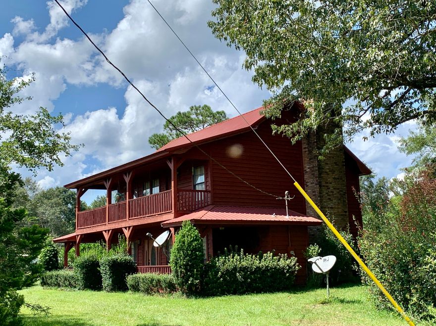 Beautiful country setting w/ hilltop home situated on just over an acre. The 3 bd/2.5 ba home has vaulted ceiling and wood burning fireplace in the living room. Nice kitchen with granite countertops and stainless appliances. Screened-in back porch and open patio with outdoor fireplace. Detached two car garage.