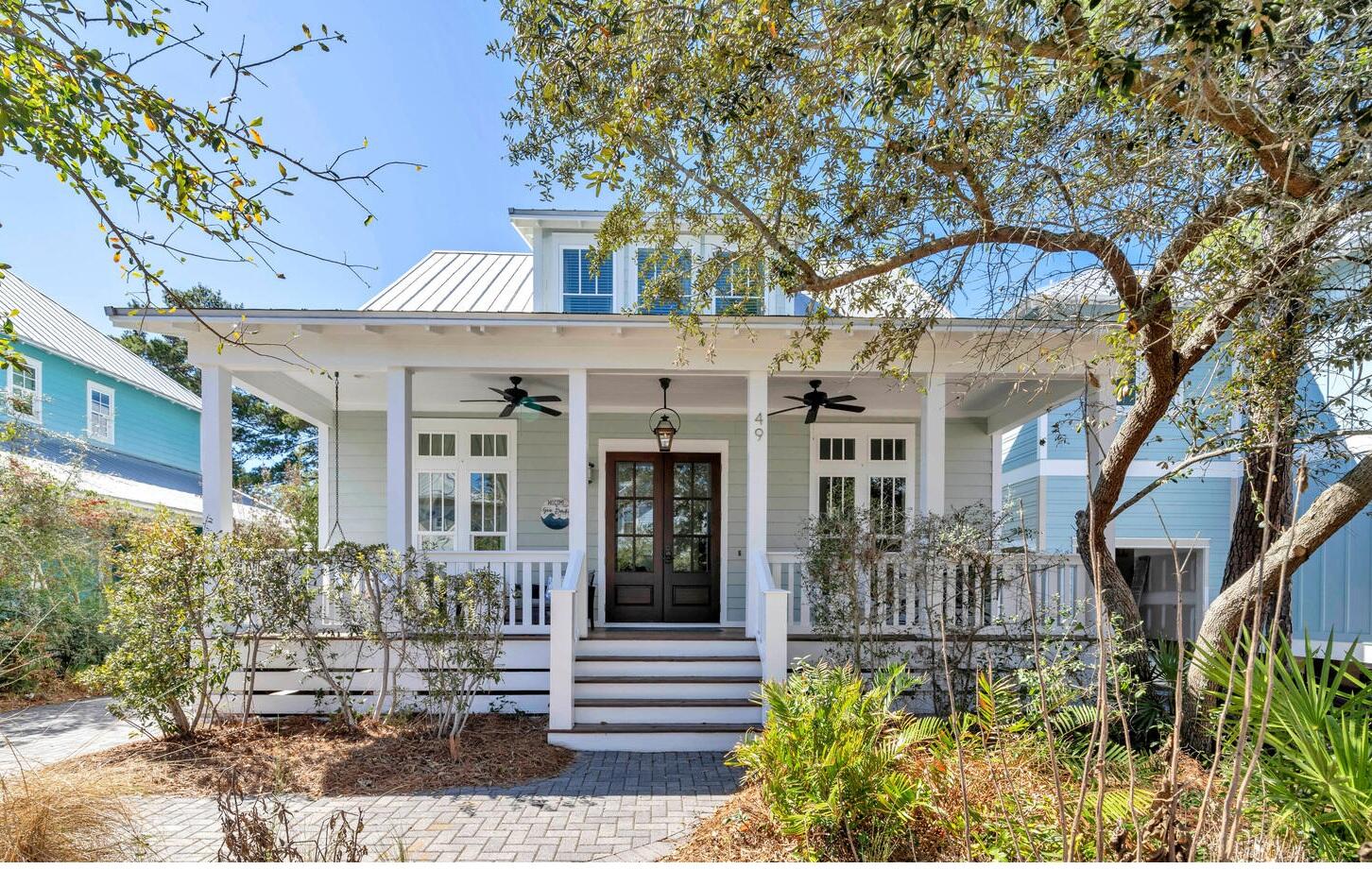 Charming Coastal Retreat just 0.6 miles to the public Blue Mountain Beach access.  Nestled in the highly sought-after Lakeside at Blue Mountain Beach, this beautifully maintained cottage offers a perfect blend of charm, comfort, and convenience. Situated on a quiet interior lot, the home welcomes you with a spacious front porch, accented by a gas lantern, setting the stage for relaxed coastal living.10-foot ceilings and floor-to-ceiling windows with transoms bathe the first level in natural light. The updated kitchen features a gas range with vent hood, coastal blue Tesoro tile backsplash, quartz and granite countertops & stainless steel appliances, Kraftmaid cabinetry. A cozy fireplace anchors the living space, while a mudroom/laundry area conveniently leads to a back porch perfect for a grill . There is an outdoor storage room and three parking spots on the driveway. and one parking space streetside.  
The first-floor owner's suite is privately situated and features a spa-like bathroom with a soaking tub and an oversized walk-in shower. Upstairs, two generously sized bedrooms each offer ensuite bathrooms.  The spacious bunk room has a TV area.
Walk, bike or drive just 0.6 miles to the public Blue Mountain Beach access with parking.  A path from the neighborhood leads to Redfish Village where you can enjoy a meal or live music at Red Fish Taco.  This home is perfectly positioned near 30A's vibrant coastal lifestyle.  In close proximity to Watercolor, Seaside and Sandestin and located on the West end of 30A, Lakeside at Blue Mountain is surrounded by Point Washington State Forest which offers miles of scenic hiking, biking, and nature trails through lush pine forests and rare ecosystems including Big Redfish Dune Lake. Outdoor enthusiasts will also love the home's proximity to Grayton Beach State Park which has hiking, camping and beach access. For dining and entertainment, enjoy local favorites like Red Fish Taco, and Blue Mountain Creamery, Blue Mountain Bakery, Cowgirl Kitchen and Johnny McTighe's Irish Pub and many more shops and eateries along Scenic Highway 30A.
Whether you're looking for a primary residence, vacation home, or investment property, this home offers the perfect balance of relaxation, adventure, and charm in one of Blue Mountain Beach's most coveted communities.  Home is on a short term rental program.  Sold furnished. Buyer to verify all dimensions.

