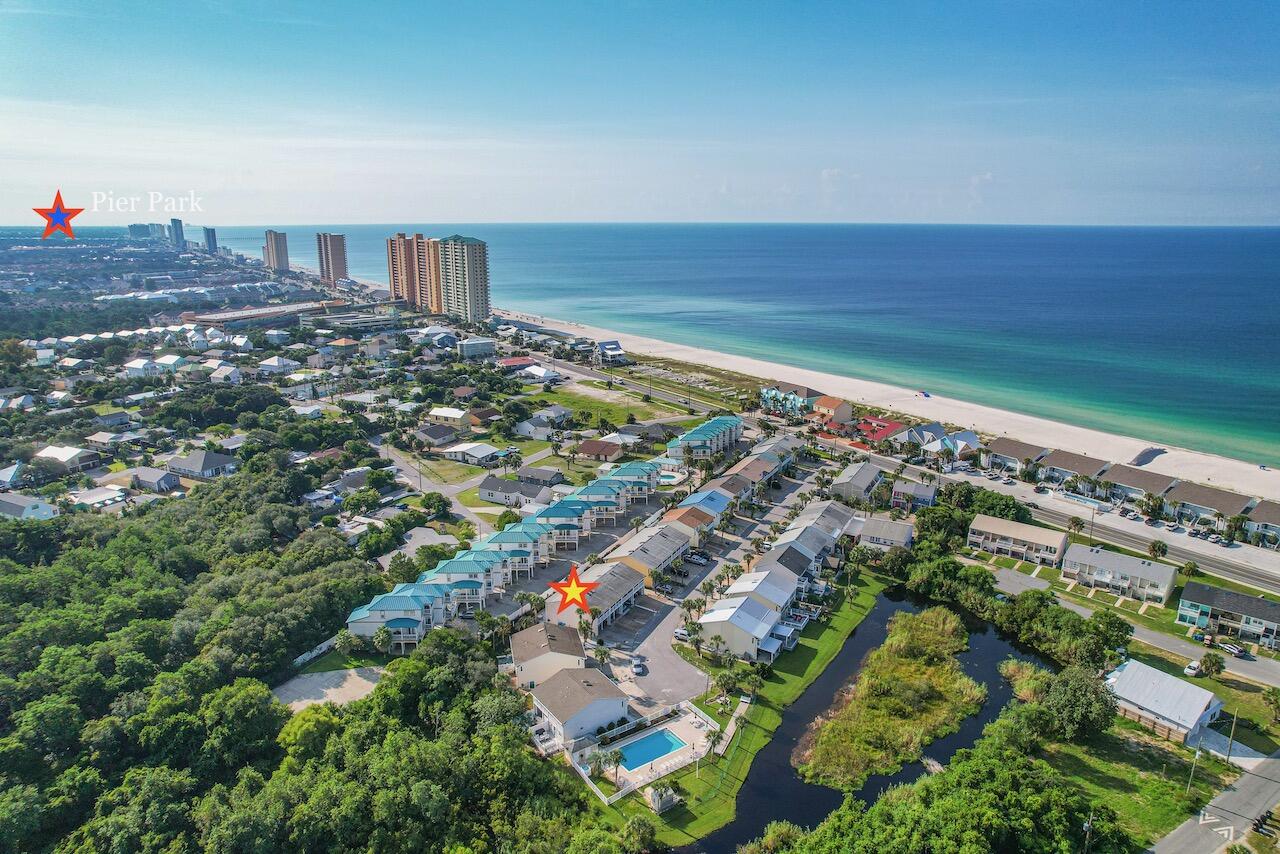 Located on the West End, away from the crowds. End Unit in the rear away from the complex entrance, but just feet away from the beach. Across from the pool and the small lake on the property. Due to the lot location it is larger than most of the other lots in the complex. An operational water fountain surrounded by palms and other foliage makes for a peaceful place to enjoy the back area. The owner has closed in the upstairs back to add a bonus room and the storage unit is oversized to allow for extra space. New storm shutters, skylight, quartz countertops. stove, cabinets in the downstairs bathroom. LVP downstairs, carpet upstairs. These owners were meticulous in the upkeep and it shows. Never in the 27 years they have owned it has the unit been on the renters market. Villa Chateaus is a