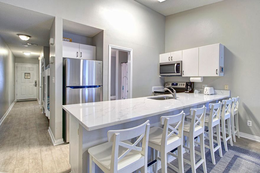 Enjoy the Emerald Coast beach life!  Gulfview II is located across Scenic Gulf Drive in the heart of Miramar Beach a prime location for maximum rental income potential. This third floor condo sleeps six, comes fully-furnished with hallway bunks, a king in the master and a sleeper sofa. Owners and vacationing guests can enjoy deeded beach access, plenty of parking, two community pools, hot tub, laundry facilities and a grill area.  The condo also features a, new roof, NEW SS dishwasher, range, refrigerator and microwave, updated quartz countertops and new bedroom flooring. A/C was replaced 2021. Guests have many dining, shopping and entertainment options within close proximity of the complex.