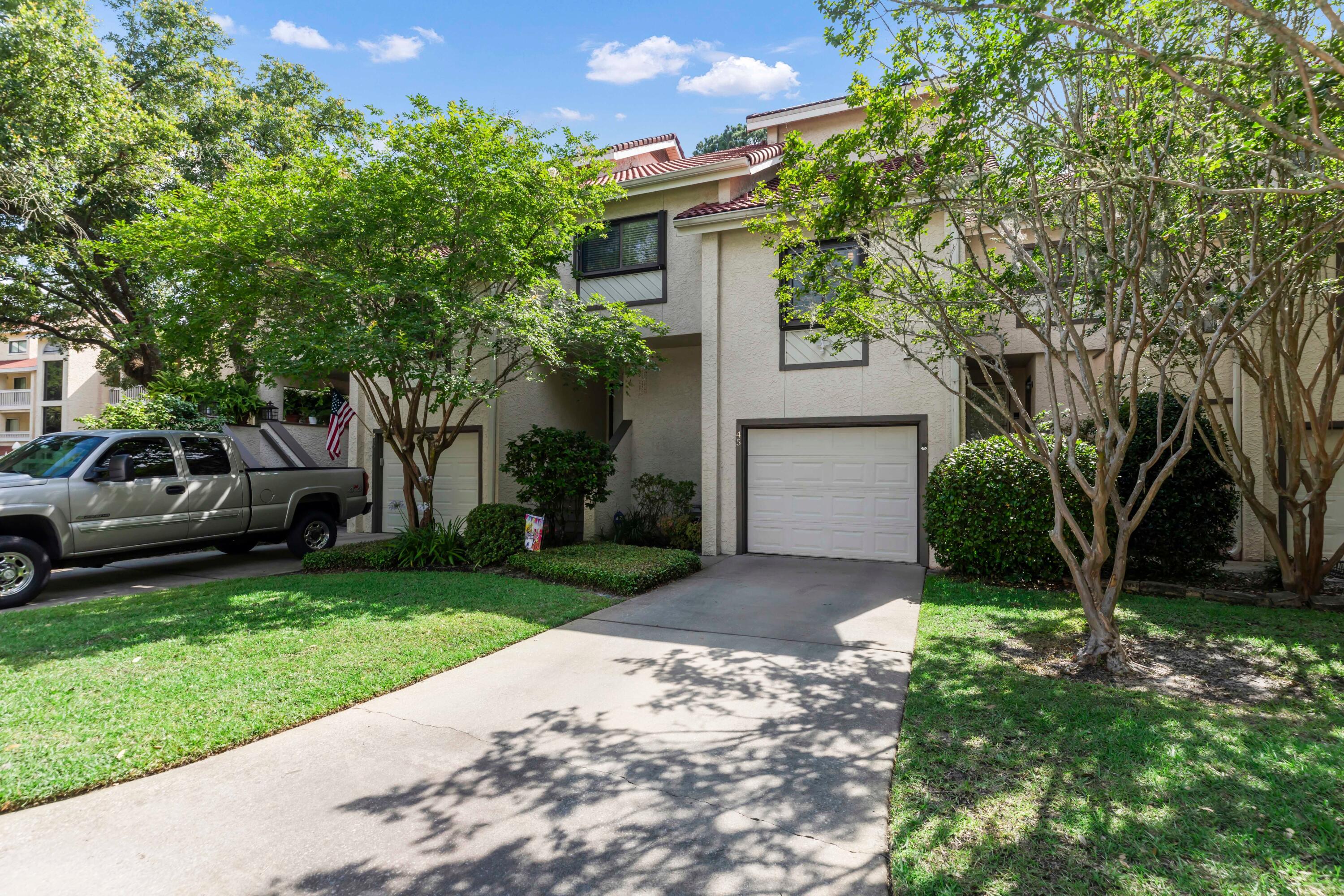 Come see the most amazing views from this waterfront townhome located on the bay in the most sought after area of Bluewater Bay. This unit will not disappoint with 2 bedrooms and 2 and 1/2 baths. As you step in the front door you are met with beautiful hardwood floors and a view of the water shinning through the sliding glass doors. Walk up the stairs to the next floor where the kitchen, dinning room and sitting area await. The sitting room is an area you could sit for hours watching the picturesque activities on the water. Sailboats and dolphins will captivate your attention. Continue up the stairs to an area that can house your office desk along with a bedroom/bathroom. Take the last set of stairs to your master suite with loft. The garage is equipped with