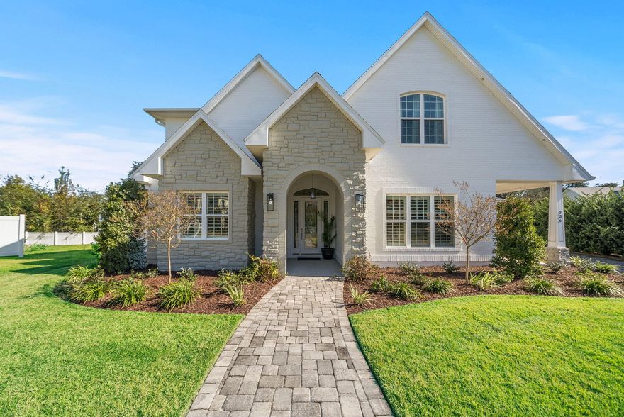 This custom, modern 4 Bedroom, 3 Bath French Country-style home with a POOL is truly stunning and was built in 2017 and nestled on a cul-de-sac in the intimate, highly coveted enclave of Cove Pointe. Tucked inside the historic and beloved Cove neighborhood, you'll find a community where oak tree-lined streets meet true coastal-Florida living. This remarkable home exudes beauty and delivers the best of indoor-outdoor lifestyle with a pool and spa, light-filled floor plan with high ceilings, designer finishes, and a backyard oasis you'll never want to leave. Step inside and you're greeted by a gorgeous dining room, elegant hardwood floors, soaring ceilings, and an open layout with just enough separation, perfect for entertaining! The great room flows seamlessly into the kitchen where you'll find a beautiful Quartz island, plenty of seating, custom cabinetry, double ovens, a gas range, large walk-in pantry and breakfast area. The living area is showstopping with coffered ceilings, enhanced lighting for any event, arched entryways, arched built-ins and a wet bar with wine cooler that is sure to impress. 

A full glass sliding, stacking door opens the great room to the nearly 600 square feet screened porch that extends from the primary suite to the kitchen! You are going to love the indoor-outdoor lifestyle this home in the Cove provides. 

Slide open the doors and jump into the Cove lifestyle with your own private heated saltwater pool and spa! Lush landscaping with a fully fenced yard surrounds the pool and an area perfect for gardening or additional area for the kids to play is just off the end of the driveway connected to the oversized, attached 2-car garage. An additional covered patio is located on the front of the home, just off the dining room, perfect for that alfresco dining we love in Florida year-round! 
Whether it's morning coffee, Saturday swim parties, or festive poolside nights, this outdoor living space delivers the lifestyle the Cove is known for. 

The split floor plan offers a main level primary suite with French doors to the pool and screened porch, two custom walk-in closets, and a spa-inspired en-suite featuring large double vanities, glass walk-in shower, and a freestanding soaking tub flooded with natural light. A second bedroom and beautiful bath are also conveniently located off the kitchen on the main level, while upstairs offers two additional generously sized bedrooms with a full bath, perfect for guests or family! 

Practicality meets luxury with an oversized two-car garage, perfect for this golf cart-friendly community and being able to access booming Downtown Panama City easily! 

Featured highlights of this home include full pavered driveway, mature landscaping, Wi-Fi-enabled pool controls, security cameras, surround sound, automated sprinklers, and a spacious mud room/utility room with deep sink, ample counterspace and extra cabinetry. The lifestyle in the Cove is truly unmatched. Enjoy a quick walk or bike ride to many of the waterfront parks in the Cove, sunsets at Beach Drive, or golf cart to Downtown where you'll find restaurants, boutiques, farmers markets and weekly community events! The St. Andrews Bay Yacht Club is within a few miles and a public boat ramp and boat storage is just around the corner. This is more than a home. It's a home in one of Panama City's most beloved neighborhoods, the Cove...where charm and comfort meet Florida's coastal lifestyle.