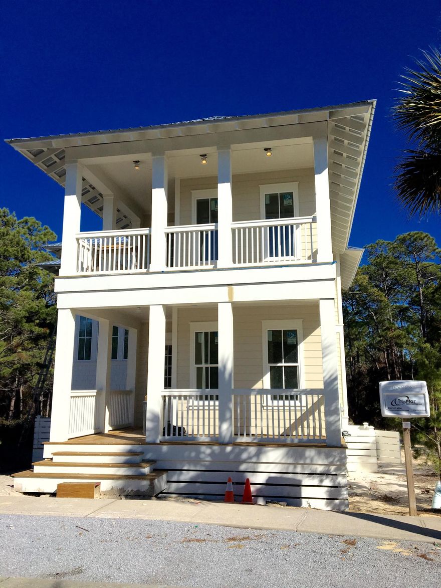 This Chi Mar constructed home will impress the moment you walk in with the open spaces and 30A beach charm. Perfectly located on a serene street, away from the hectic 'hub'' of Seacrest, this home backs to the mature natural preserve providing a back drop of privacy and solitude. An open concept kitchen, featuring carrara marble, beautiful high end appliances and a custom island opens to the massive dining and living spaces, which are filled with distinctive architectural features and plentiful upgrades. The main level also offers a master suite and large screened-in porch with grilling station. Ascend to the second level and prepare to be impressed with the large master suite with a dramatic pitched ceiling and sumptuous spa like bathroom. An additional guest bedroom and bunk room