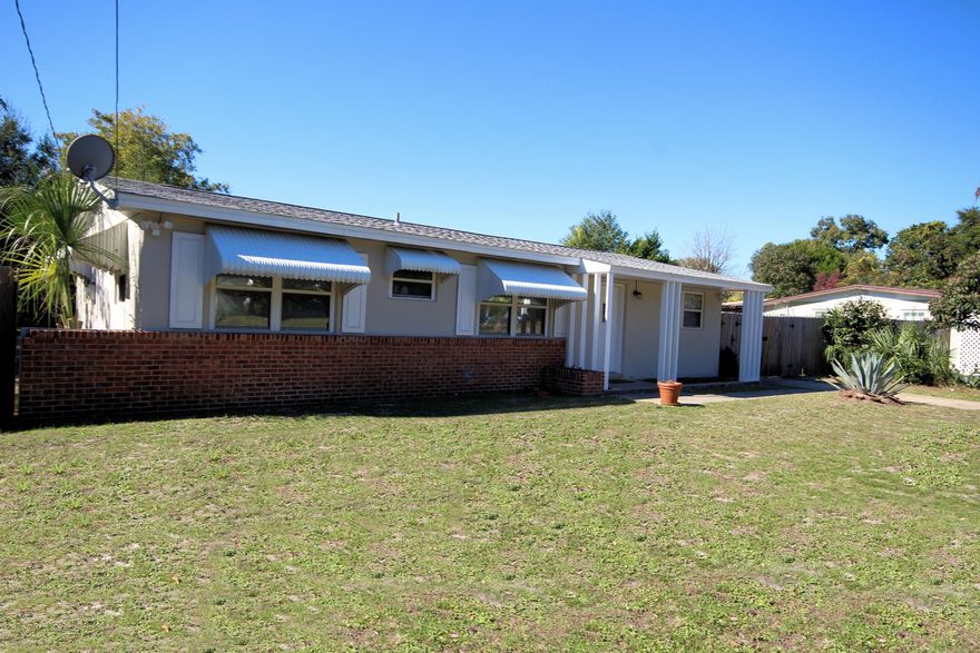 Move in Ready!! 4 Bedroom 1 3/4 bath split floor plan home. Freshly painted with new tile and ceiling fans with lots of closet space for storage. Updated bathrooms with like new appliances. Large backyard!! New roof installed in 2014. Drive way extends into back yard for additional parking. Must see property to appreciate. Property is being sold ''AS IS''. Seller will purchase a home warranty.