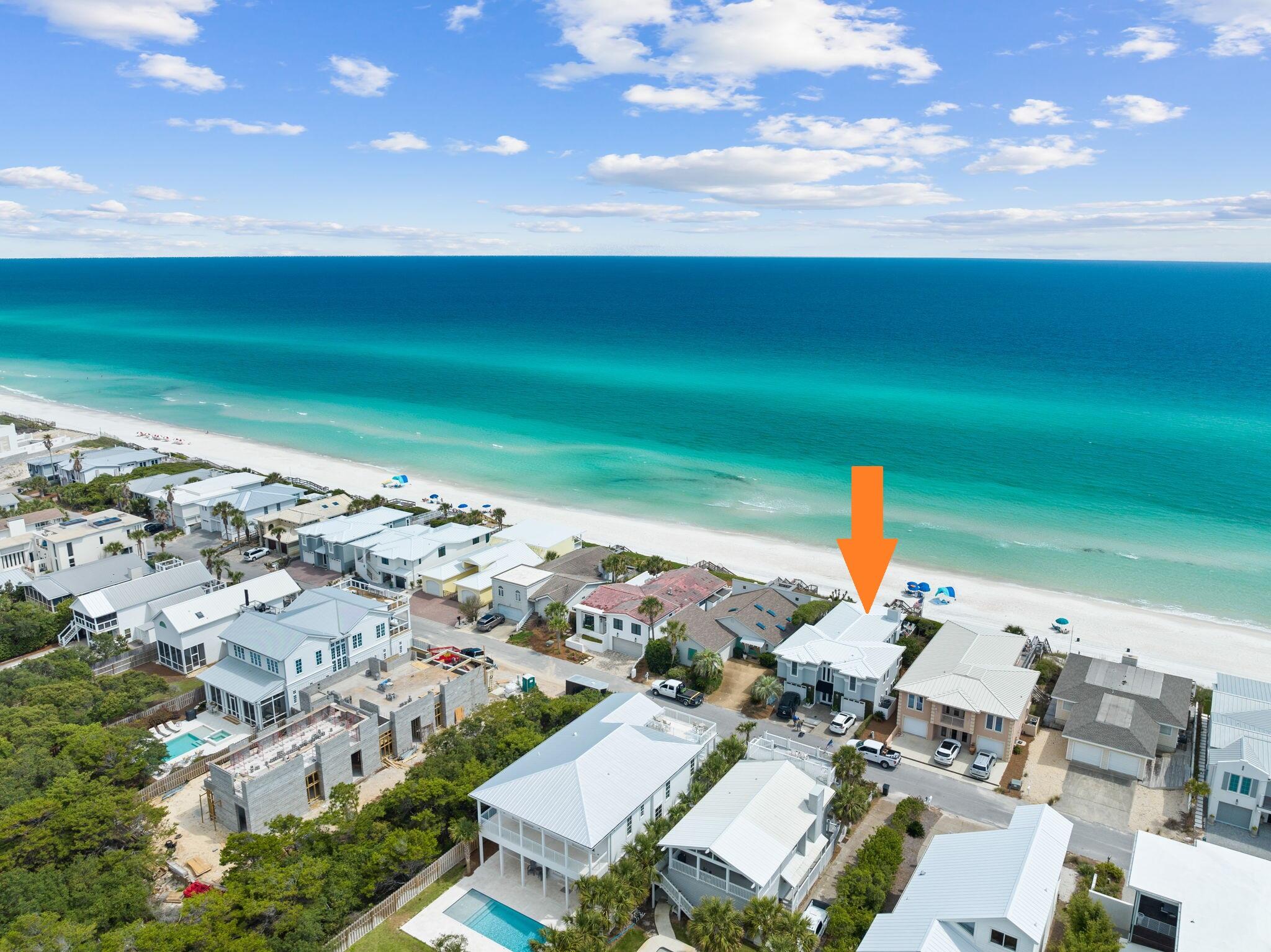 Welcome to 218 SAND CLIFFS ON THE GULF! This home is situated high above the sandy shores, offering an impeccable view of the mesmerizing Gulf of Mexico. As you step inside, you'll be greeted by a stunning foyer adorned with reclaimed brick flooring and an open soaring ceiling, creating an impressive entrance. To your left, a spacious laundry room awaits, complete with a cozy sitting area that could be transformed into a media space, perfect for relaxation. Adjacent to this room, you'll discover a private deck access featuring an outdoor shower, providing direct access to the main back deck overlooking the gulf. On the opposite side of the foyer, a charming small bunk room awaits, offering a cozy space for guests. Conveniently nestled between the two rooms, you'll find a full bathroom.