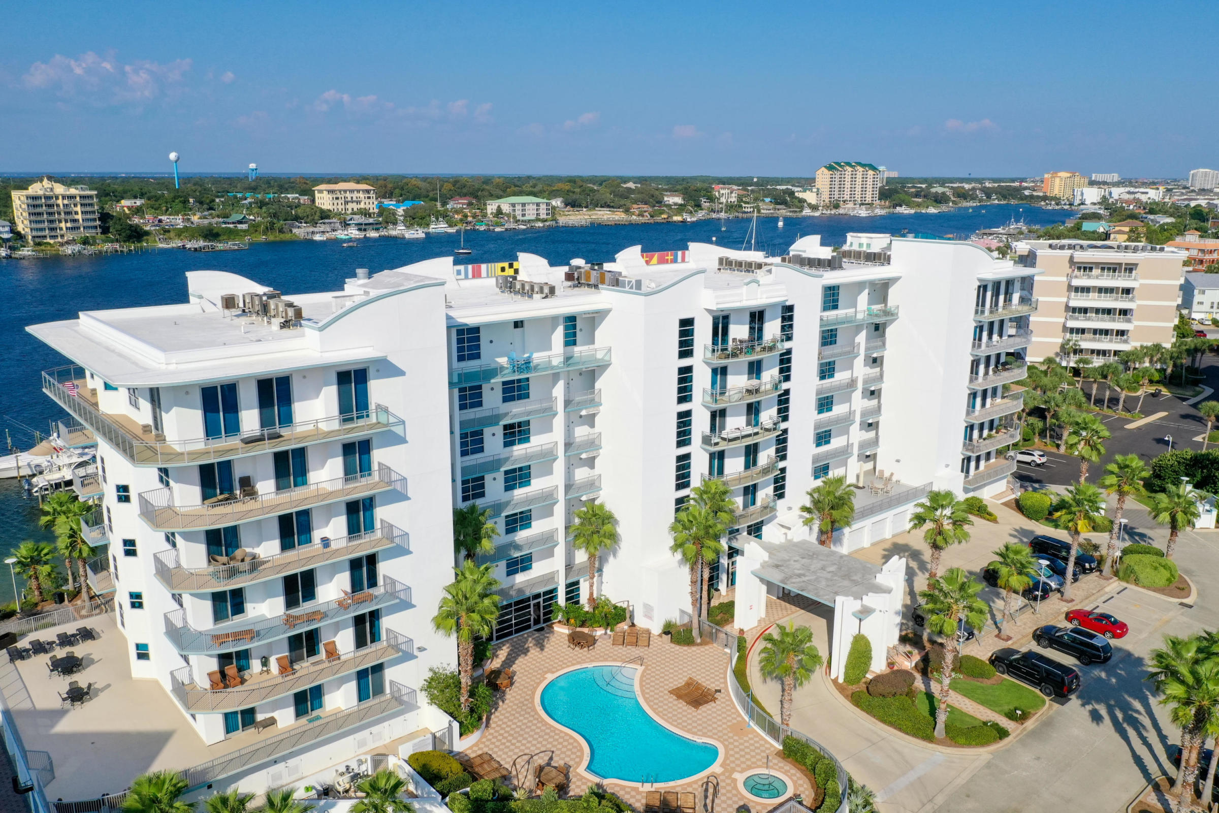 This unit is a very desirable center stack located at Harbor Lights (A beautiful newer built prominent 7 story condo nestled on the Destin Harbor and located on Holiday Isle) It includes luxurious amenities and panoramic views of the Destin Harbor and canal. This center stack unit offers two entrances with access doors to the east AND the west elevators.The private balconies offer clear glass panels for unobstructed views of the harbor and canal. All bedrooms have waterfront views with the master being on the harbor. The amenities include a 1050 sq ft pool, fitness room, steam room, sauna, AND a harbor front club house. NO short terms rental makes this a very quiet retreat!!! Community is gated and owner pets are allowed with a gated dog park provided. Storage unit included.