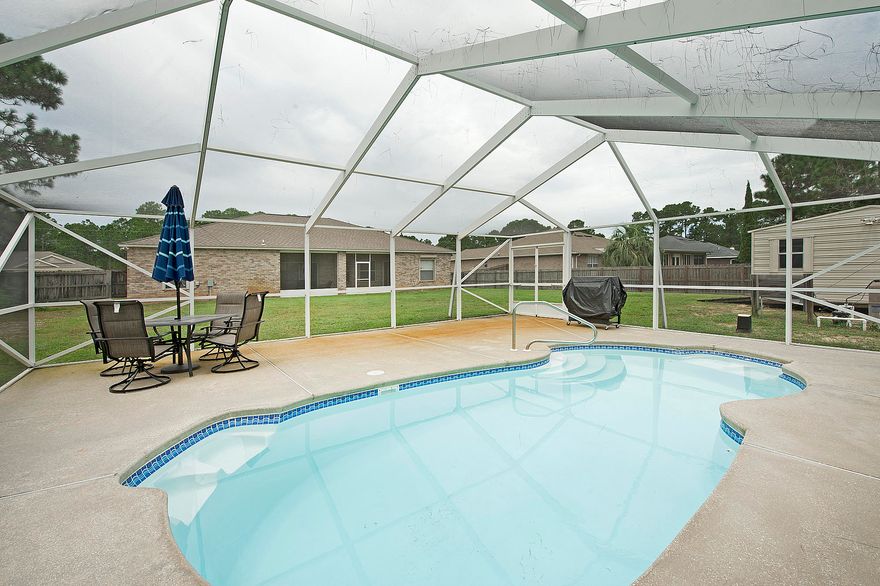 Amazing and spacious POOL HOME in Holley By The Sea on a cul-de-sac! This home has a brand new HVAC installed September 2017, new lawn pump installed July 2018 and new pool pump installed August 2018. Windows are equipped with roll-down storm shutters. Windows on the back side of the house are tinted to add additional hurricane protection, and there are detachable hurricane screens that protect the screened porch, garage and front door. This 4 bedroom, 2 bathroom home features a split floor plan, cathedral ceilings and a screened in in-ground pool! There is plenty of space for entertaining guests throughout the home. When you first walk into the home, you will see the living room, formal dining room and great room. There is plenty of counter space in the kitchen, with a large pantry and