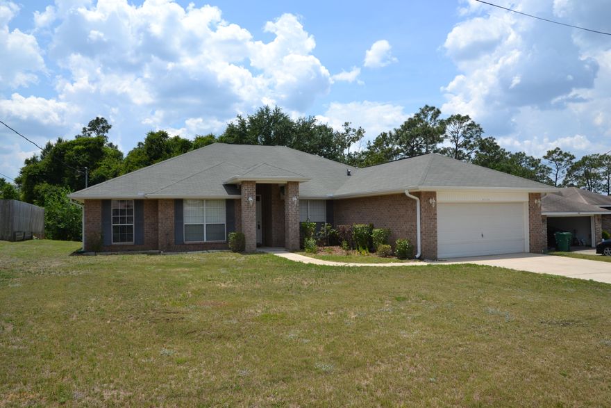 NEW Flooring, NEW Paint, South Crestview, Home Warranty, and $2,500 towards CLOSING COSTS! 2,560 sq.ft., Split Bedroom with 4 Bedrooms, 2 Bathrooms, Eat in Kitchen, Formal Dining Room, and an Office/Den! Living Room has a corner fireplace and vaulted ceiling. Master Suite is located off the Living Room and has a Master Bath with double closets, separate vanities, separate shower, and soaker tub! Additional Bedrooms are located on the other side of the home and share the 2nd Full Bathroom. Enjoy the outdoors and your wooded view on the back deck. Kitchen has plenty of cabinet and counter space, a breakfast bar and a pantry! Schedule your showing today!