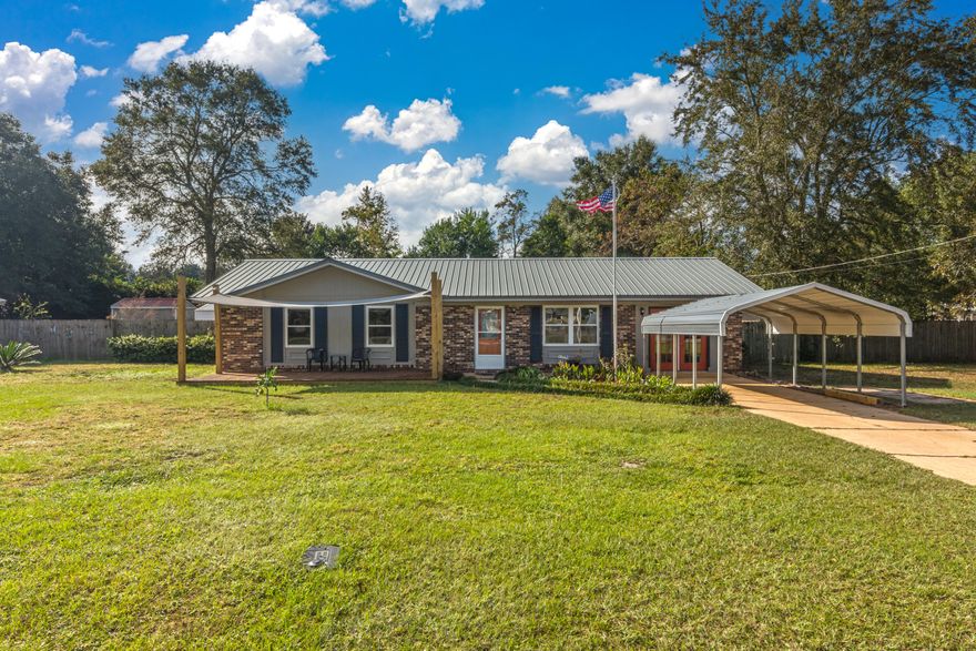 Wonderful home on amazing, flat .42 acre lot! This property is centrally located to schools, shopping and businesses. Recent updates include fresh paint w/neutral colors throughout, LVP flooring, and replaced carpet. The metal roof and HVAC were replaced in 2010, windows in 2012, water heater 2015. The kitchen features updated cabinetry with extra storage space and an eat-in dining area. Large screened-in porch (350sqft) overlooks a great fenced yard and is perfect for enjoying Florida evenings. Outdoor storage includes a 18x36 shed and 8x12 shed. This would make a great starter home or rental property!