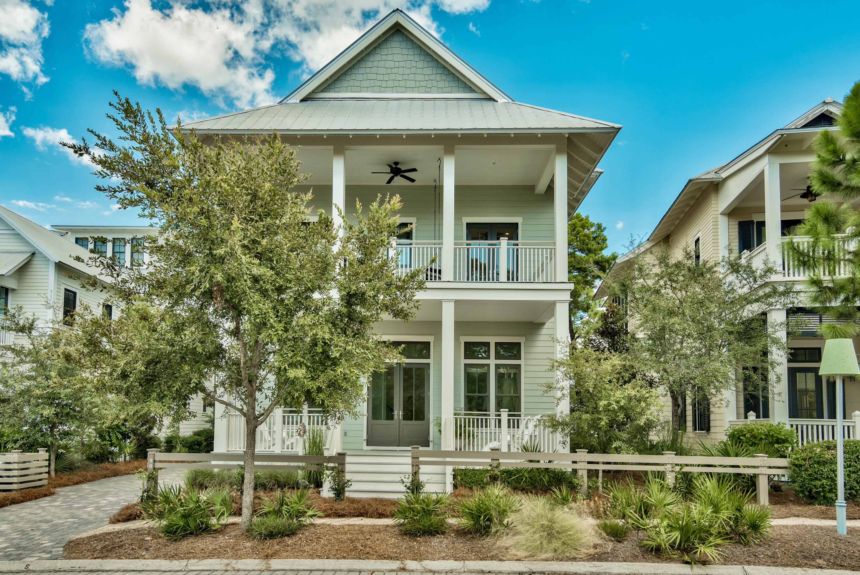 Thurber Architects designed this 5 bedroom, 4 full and two 1/2 bath home that lives large with a spacious and open floor plan. Perfect for multiple families and entertaining located in WaterColor's Wiregrass Meadows neighborhood. Homesite sits facing a naturally wooded area with a wooden walking trail allowing lots of privacy from the back screened in porch that is perfect for outside dining. Many custom features including 2 Riannai tankless water heaters, dark stained oak flooring throughout, stainless steel kitchen appliances (including warming drawer and separate ice machine), outdoor storage and impact grade windows and doors. Master suites on both the 1st and 2nd floors with double vanities and air tubs in private baths.Two additional guest suites on 2nd floor and a bunkroom