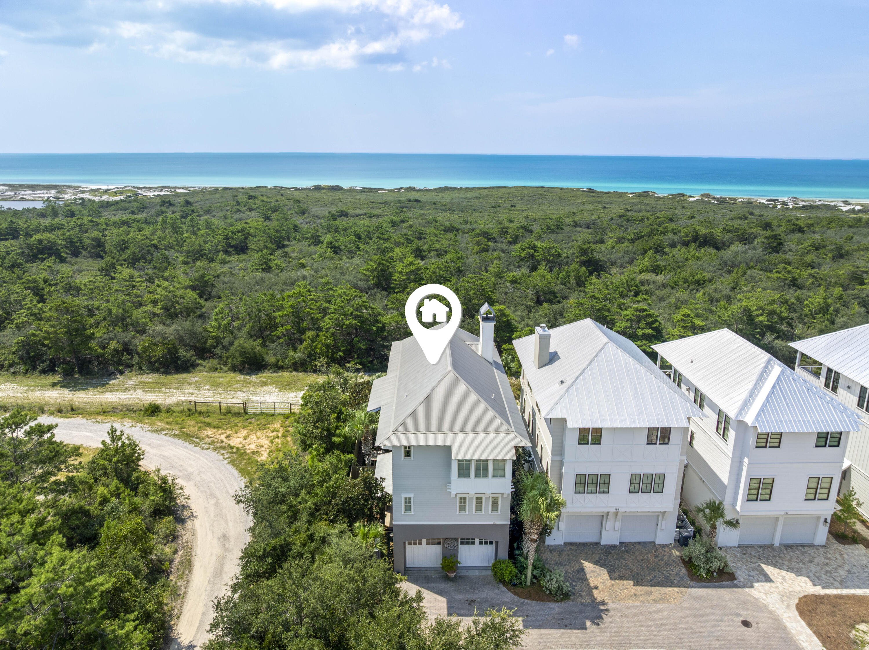 Located in the private, gated community of Cypress Dunes on the west end of 30A, this beautifully furnished 4-bedroom, 4.5-bath home offers exceptional privacy and panoramic Gulf views. Positioned on one of the most desirable lots in the neighborhood, the residence features a spacious third-floor living area with two seating spaces, a modern kitchen, and a dining table for 10. Telescoping sliding glass doors lead to a large covered balcony with an outdoor kitchen and ample seating, perfect for entertaining. The home is equipped with an elevator and offers three additional bedrooms on the second level, including a master suite with a fully renovated bathroom, custom closet, and screened porch with swing. The first floor features a large bunk room, full bath, and a generous laundry room. A fenced backyard with artificial turf and an outdoor shower adds to the low-maintenance appeal.
Community amenities include a resort-style pool overlooking Topsail Hill Preserve State Park and the Gulf of Mexico, a hot tub, clubhouse with fitness center, tennis and pickleball courts, nature trails, and beautifully landscaped green spaces.
Available now. Offered fully furnished. Certain pets allowed with approval.