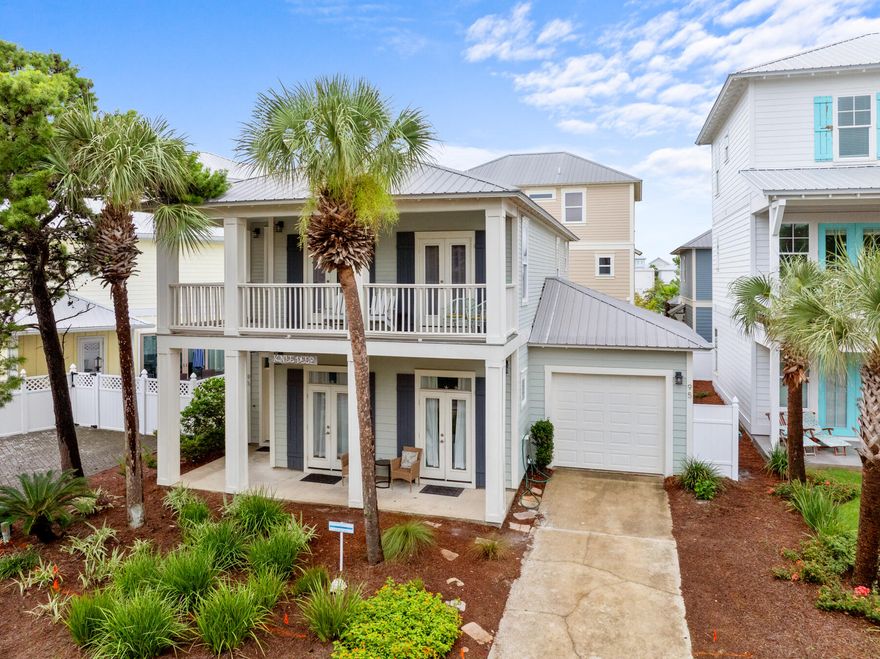 Welcome to 'Knee Deep,' an exquisite 4-bedroom, 3 and 1/2 -bathroom coastal sanctuary, masterfully constructed with concrete block in the exclusive gated community of Emerald Waters Village. Spanning 2,216 square feet, this impeccably designed residence offers the perfect blend of sophistication, comfort, and coastal charm, just a short stroll from deeded beach access with sugar-white sands and emerald waters of Miramar Beach. Step into a light-filled, open-concept main level where refined elegance meets effortless functionality. The gourmet kitchen, a culinary haven, boasts newer stainless steel appliances, sleek cabinetry, and a spacious island ideal for gatherings. Adjacent, the inviting living and dining areas create a seamless flow, perfect for entertaining or unwinding. Also a generously sized bedroom with a luxurious ensuite is located on the first floor. A laundry room, and access to the garage (perfect for storing your golf cart or beach car) complete the first floor, offering unmatched convenience and versatility. 
Ascend to the second level, where three additional bedrooms await, each designed for ultimate comfort. Two bedrooms share a stylish Jack-and-Jill bathroom, while the second master suite, a true retreat, features a private ensuite and a serene balcony overlooking the lush surroundingsperfect for savoring morning coffee or evening sunsets. 
Outdoors, the fenced backyard with a charming patio sets the stage for al fresco dining, grilling, or simply soaking in the coastal breeze. Built in 2004, 'Knee Deep' combines timeless architecture with modern upgrades, including two newer HVAC units, all-new appliances, and a washer and dryer, ensuring turnkey luxury. The attached garage provides ample storage for your golf cart or beach car. As part of Emerald Waters Village, residents enjoy two sparkling community pools and the security of a gated enclave, all within minutes of Scenic Highway 98's world-class dining, boutique shopping, and vibrant entertainment. Whether you envision a primary residence, a luxurious vacation escape, or a high-yield rental investment, 'Knee Deep' delivers unmatched value. Its robust concrete block construction offers peace of mind, while its prime location and thoughtful design elevate the coastal living experience.