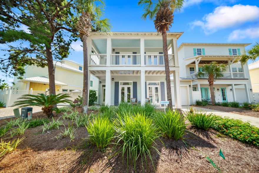 Welcome to 'Knee Deep,' an exquisite 4-bedroom, 3 and 1/2 -bathroom coastal sanctuary, masterfully constructed with concrete block in the exclusive gated community of Emerald Waters Village. Spanning 2,216 square feet, this impeccably designed residence offers the perfect blend of sophistication, comfort, and coastal charm, just a short stroll from deeded beach access with sugar-white sands and emerald waters of Miramar Beach. Step into a light-filled, open-concept main level where refined elegance meets effortless functionality. The gourmet kitchen, a culinary haven, boasts newer stainless steel appliances, sleek cabinetry, and a spacious island ideal for gatherings. Adjacent, the inviting living and dining areas create a seamless flow, perfect for entertaining or unwinding. Also a generously sized bedroom with a luxurious ensuite is located on the first floor. A laundry room, and access to the garage (perfect for storing your golf cart or beach car) complete the first floor, offering unmatched convenience and versatility. 
Ascend to the second level, where three additional bedrooms await, each designed for ultimate comfort. Two bedrooms share a stylish Jack-and-Jill bathroom, while the second master suite, a true retreat, features a private ensuite and a serene balcony overlooking the lush surroundingsperfect for savoring morning coffee or evening sunsets. 
Outdoors, the fenced backyard with a charming patio sets the stage for al fresco dining, grilling, or simply soaking in the coastal breeze. Built in 2004, 'Knee Deep' combines timeless architecture with modern upgrades, including two newer HVAC units, all-new appliances, and a washer and dryer, ensuring turnkey luxury. The attached garage provides ample storage for your golf cart or beach car. As part of Emerald Waters Village, residents enjoy two sparkling community pools and the security of a gated enclave, all within minutes of Scenic Highway 98's world-class dining, boutique shopping, and vibrant entertainment. Whether you envision a primary residence, a luxurious vacation escape, or a high-yield rental investment, 'Knee Deep' delivers unmatched value. Its robust concrete block construction offers peace of mind, while its prime location and thoughtful design elevate the coastal living experience.