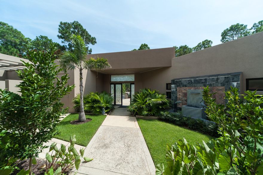 Enviably located in Santa Rosa Beach, every inch of this 4,100 sq.ft waterfront home in Shelter Cove exudes a sense of privileged luxury. Great first impressions of this 3 bed, 4 bath contemporary property are assured with its landscaped courtyard entrance and waterfall fountain. The magnificent open-plan living space has full height glass windows with stunning views beyond. A floor-to-ceiling fireplace, handcrafted bar and custom designed Mary Hong glass sculptures make interesting focal points when entertaining. The gourmet kitchen is a chef's dream with an island sink, upscale appliances, granite countertops and an exceptional family-sized breakfast bar.