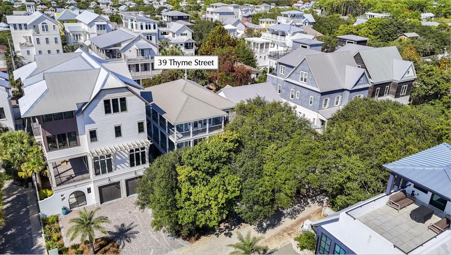 Steps from the iconic sugar-white sands of 30A, 39 Thyme blends coastal charm & effortless livability in one of Seagrove's most coveted locations. Tucked beneath a canopy of magnolias & oaks, this spacious retreat sits just 100 yards to both the Dogwood & Hickory beach accesses and a short stroll to Seaside's shops, dining & entertainment. The 5 bedroom home (plus bunk room) features wraparound balconies on the 2nd & 3rd floors, offering Gulf glimpses & multiple outdoor living spaces. The fenced backyard includes a sparkling pool, paver sundeck, grilling area, and covered patio with ping-pong & outdoor shower. Inside, the main living level is located on the 2nd floor, complete with a full kitchen, large dining area, and an inviting family room filled with natural light. A 3rd-floor den offers an additional gathering space with a wet bar & balcony access. With a bathroom for every bedroom, generous storage, plenty of driveway parking, the home lives large & comfortably. Perfectly positioned in Old Seagrove, this property is an exceptional opportunity for buyers seeking a primary residence, second home, or investment on the east side of 30A.