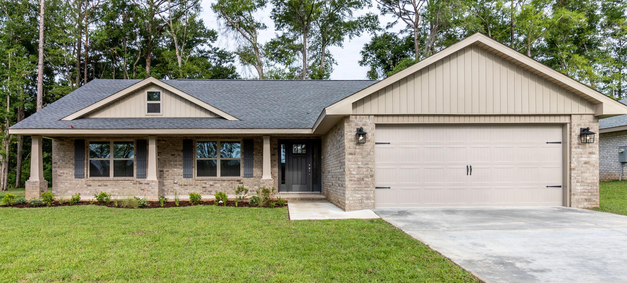Welcome to Silvercrest! Homes are 4 sided brick! This home features 4 bedrooms and 2 full bathrooms. This is a split bedroom plan as well. Square foot is 1810 with a Craftsman style. Upgrades include LVP flooring everywhere but bedrooms, granite in kitchen and bathrooms, a 14' x 16' covered back porch and a separate shower with garden tub in the master bath. The kitchen has a breakfast bar perfect for bar stools as well as a dining area overlooking the great room. The great room has a cathedral ceiling and leads out to the covered back porch. Faucets are Moen brand and vanities in the bathrooms are 36' high'.There is pull down attic access for storage in the finished garage. The lot is fully sodded and landscaped with sprinklers. Silvercrest offers underground utilities.
