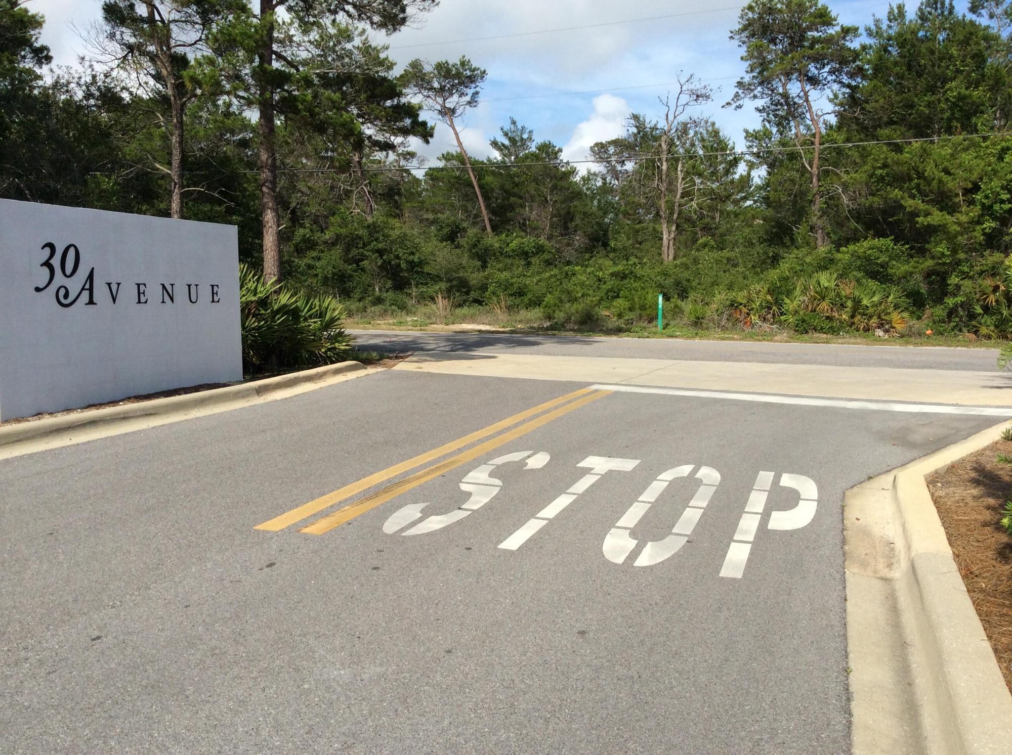 Awesome Location!!! Beautiful 1/4 acre wooded lot In Inlet Beach. Located across from the 30-Avenue entrance. Beach Access at the end of Wall Street and Inlet Beaches 19+ acre Gulf-front park is just 1 street away! Just steps from the new pedestrian underpass connecting to 30-A currently under construction!