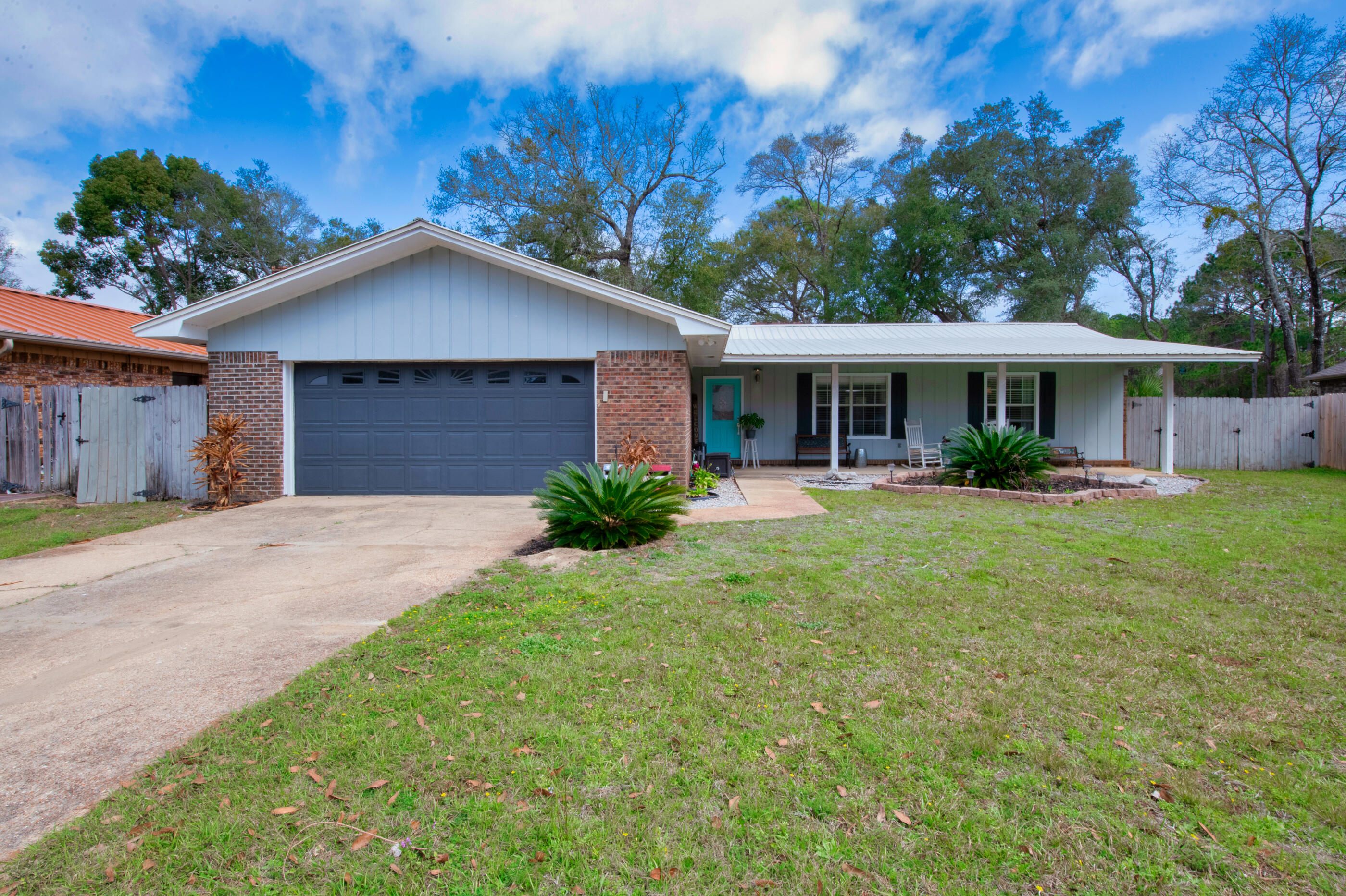A rare find, check out this beautiful renovated lake house located in the heart of Niceville. As you enter the front door you are welcomed by the bamboo flooring and open concept living. The wood burning fireplace is the focal point of the spacious living room. The kitchen features granite counter tops, updated cabinets, stainless appliances to include a wine refrigerator and an induction oven. The master bedroom has plenty of room for all your furniture. The master bathroom has dual vanities and a tiled shower. From the master bedroom you can exit to the screen enclosure to relax and enjoy all the nature and overlook the lake. The fenced back yard has a 12 x16 work shed with electricity and a 11' gate to pull your boat in the back yard. Imagine sitting on your private dock