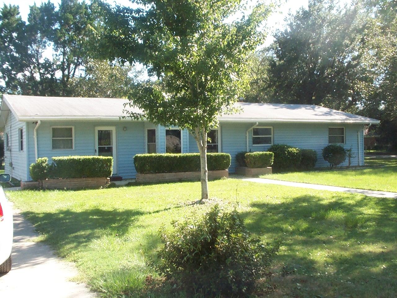 CUTE HOME! Large Corner Lot - Great Location.. This affordable lovely one story home is ideal for the first time homeowner... Freshly painted paneled walls thru out. Brand new carpet. Huge kitchen with breakfast bar adjoining the spacious dining area. Sliding doors from dining room lead out to 8' x 12' screened porch.. Family Room PLUS a Living Room give so many options for your life style. Both additional BR's are 12' x 14' - Slightly larger than the master bedroom. Very large inside laundry room with door leading outside. If you have a recreational vehicle this large corner lot is the best you are going to find!! .. There is a small metal shed, but has no value - good for lawn equipment storage.. Great Opportunity. Great Neighborhood.