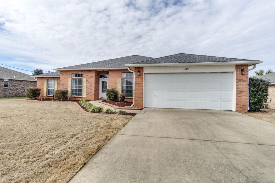 Ideal Location! South of I-10,on a 1/4 acre lot that will accommodate a pool!This 4bd/3 full bath home has a Florida Room and an office,large covered back porch, New wood plank ceramic flooring throughout (only 3 bedrooms with carpet), complete kitchen renovation with custom built double stacked wood cabinets with glass door insets,wood pullouts and soft close doors and drawers, butcher block island, stainless appliances,dimensional subway tile backsplash and pantry. Guest bathroom/ in-law quarter had tub replaced with new walk in shower! The home features Crown molding, alarm system, fireplace, custom window treatments, custom concrete landscape curbing and irrigation system, roof replaced in 2012,formal dining, and HUGE master suite!Easy commute to area Bases!Move in ready, act fast!