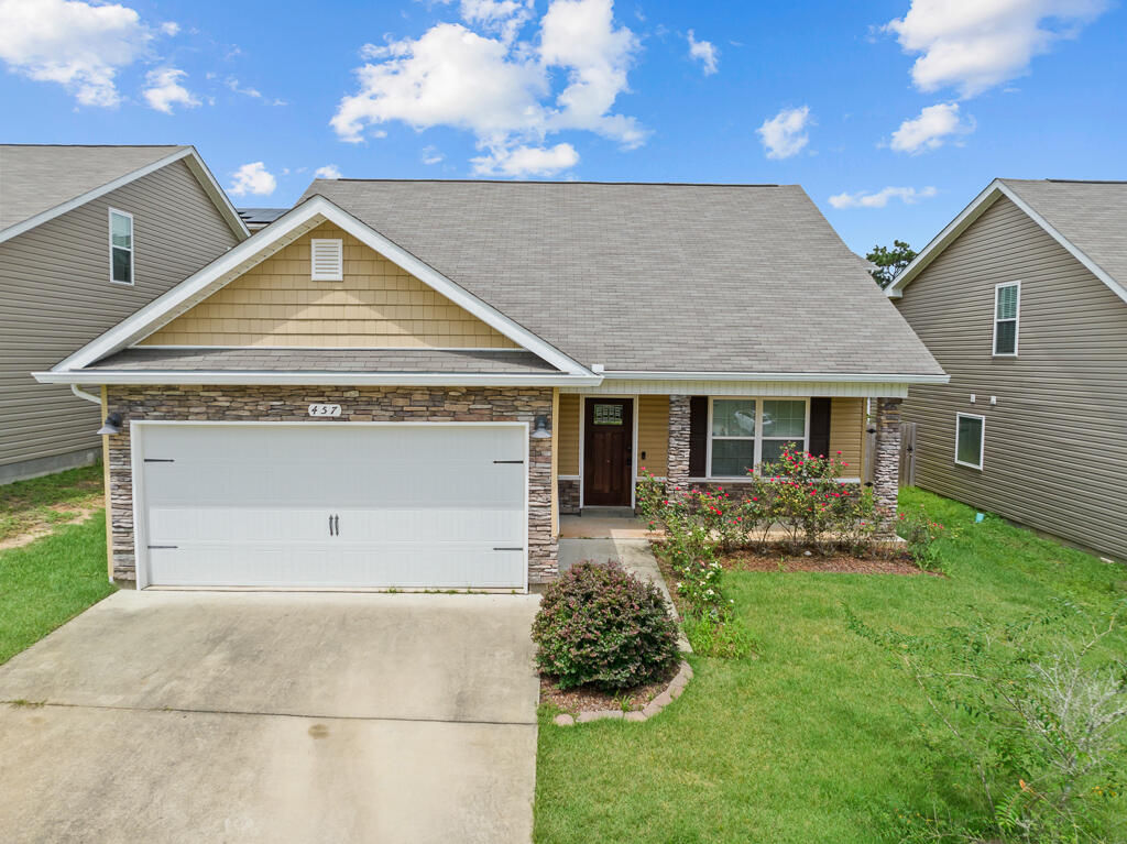 Welcome to this beautiful five-bedroom home in Stillwell Estates! Upon entering this home through your covered front porch, you will find a spacious living room, large master suite, kitchen, dining room and a half bathroom. Upstairs, there are four additional bedrooms sharing a bathroom that features double vanities. The downstairs area is outfitted with stylish wood-look luxury vinyl plank flooring, which continues throughout the main level, including the kitchen and master suite. The kitchen is equipped with stainless steel appliances, white cabinetry, modern pendant lighting, and a spacious pantry, while the eat-in dining area showcases a charming wood accent wall. The owner's suite offers a tranquil retreat, complete with a bathroom featuring double vanity sinks, dark bronze fixtures, a walk-in shower, and a garden tub. Upstairs, the four additional bedrooms provide plenty of closet space for all your needs. Enjoy the fantastic location and make this your new home! Schedule your showing today. 