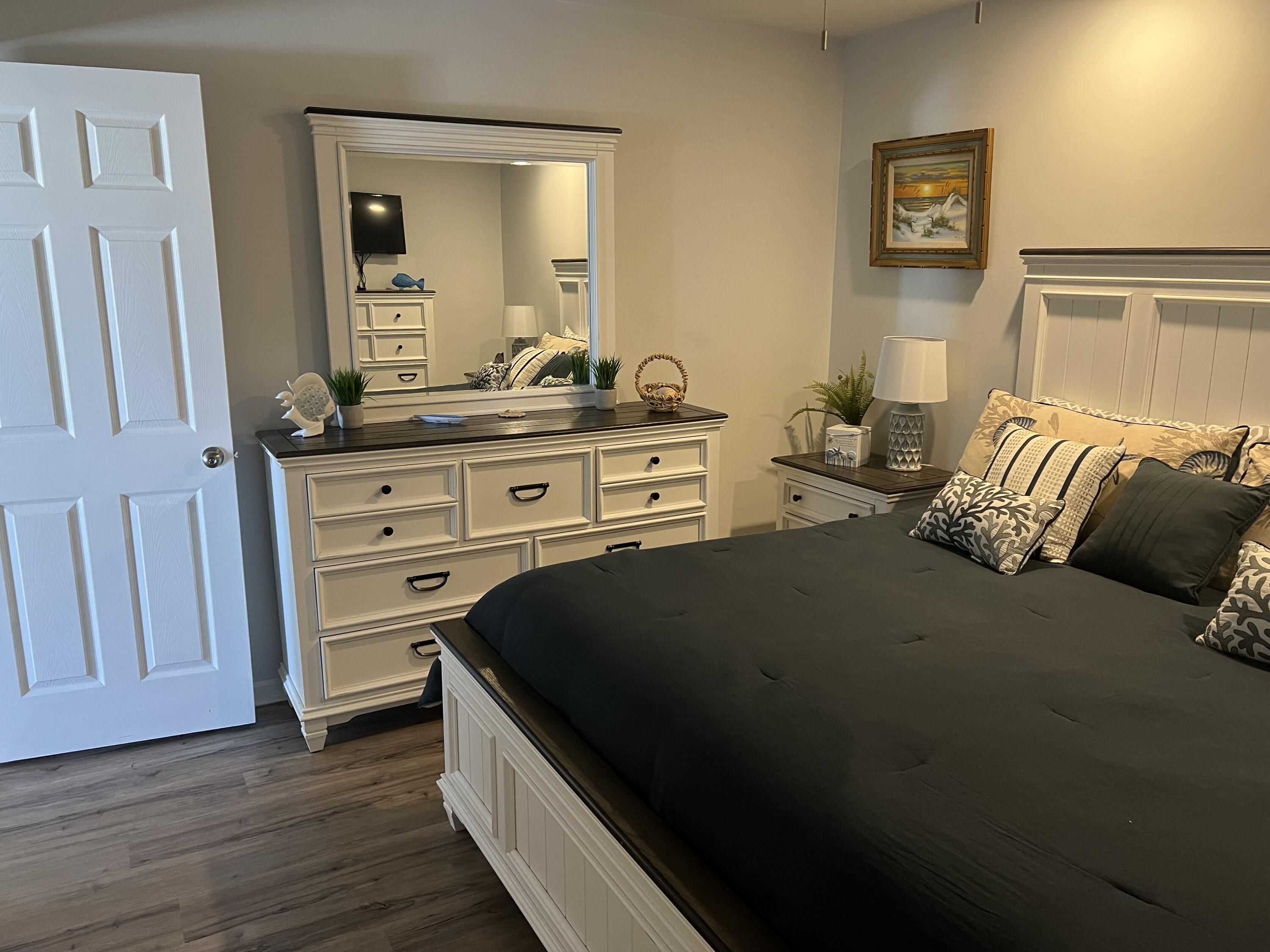 Looking for the perfect beach property? This is it, the whole package! Located on the West end of PCB, this 2 bedroom 2 bath condo has it all! For starters lets talk about this location! Nestled in the gated community of Horizon South. This resort is conveniently located just a short 5 minute drive to Pier park, a 15 minute drive to 30A or the ECP Airport and an easy 5 minute walk to the BEACH! Horizon South offers a family friendly atmosphere with (4) Pools, Hot Tubs, Tennis Courts, Pickle Ball, Shuffleboard ,putt putt golf & so much more! This unit is turn key, just bring your toothbrush! New hurricane windows and doors installed summer 2021. Renovated in the Spring of 2021 with LVP flooring, new paint, lighting, kitchen and bath updates and all new furniture! Yes, everything from the TV's, mattresses even down to the dishes were replaced! This would make a great 2nd home or primary residence however if you are buying this for an investment property, then you will love your ROI on this one! Blue Horizon already has approx. $26,000 in Gross revenue on the books for 2022 and we are just getting started, with projections of over $40,000 in Gross Revenue this year! This is an amazing unit and the guest think so too, Blue Horizon always has great reviews and feedback. Here are a few of my favorite features a large first floor master bedroom, lots of storage, private fenced in patio, tall ceilings, well the list goes on and on! Don't let this one slip away call me or your favorite agent today for a private tour 850-899-4008!