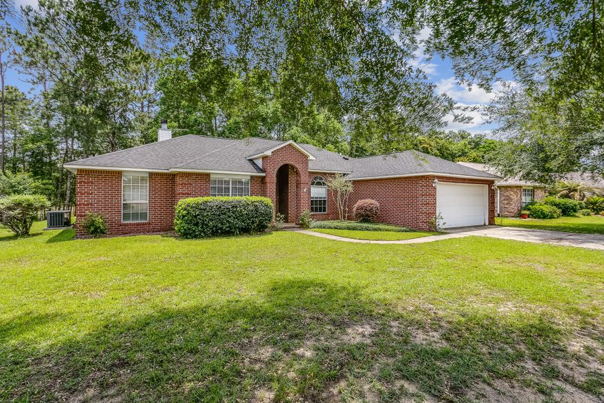 All brick home in The Moors Golf & Racquet Club, 3 bed and 2 bath plus a bonus room with just over 1900 square feet. Home features a 2 car garage, and a wood lined backyard. Inside the home you will see a fireplace as the focal point in the living room, with sliding glass doors providing natural light and access to the backyard patio. The kitchen has stainless steel appliances to include a wine fridge built into the center island that has a butcher block work area. Home has a breakfast nook off the kitchen as well as a formal dining room with a chair rail feature. Wood vinyl plank throughout the home, and carpet in the bedrooms. Main suite has a large walk in closet, attached bath has dual sinks, soaker tub and separate shower. Landry is inside the mud room adjacent to the garage