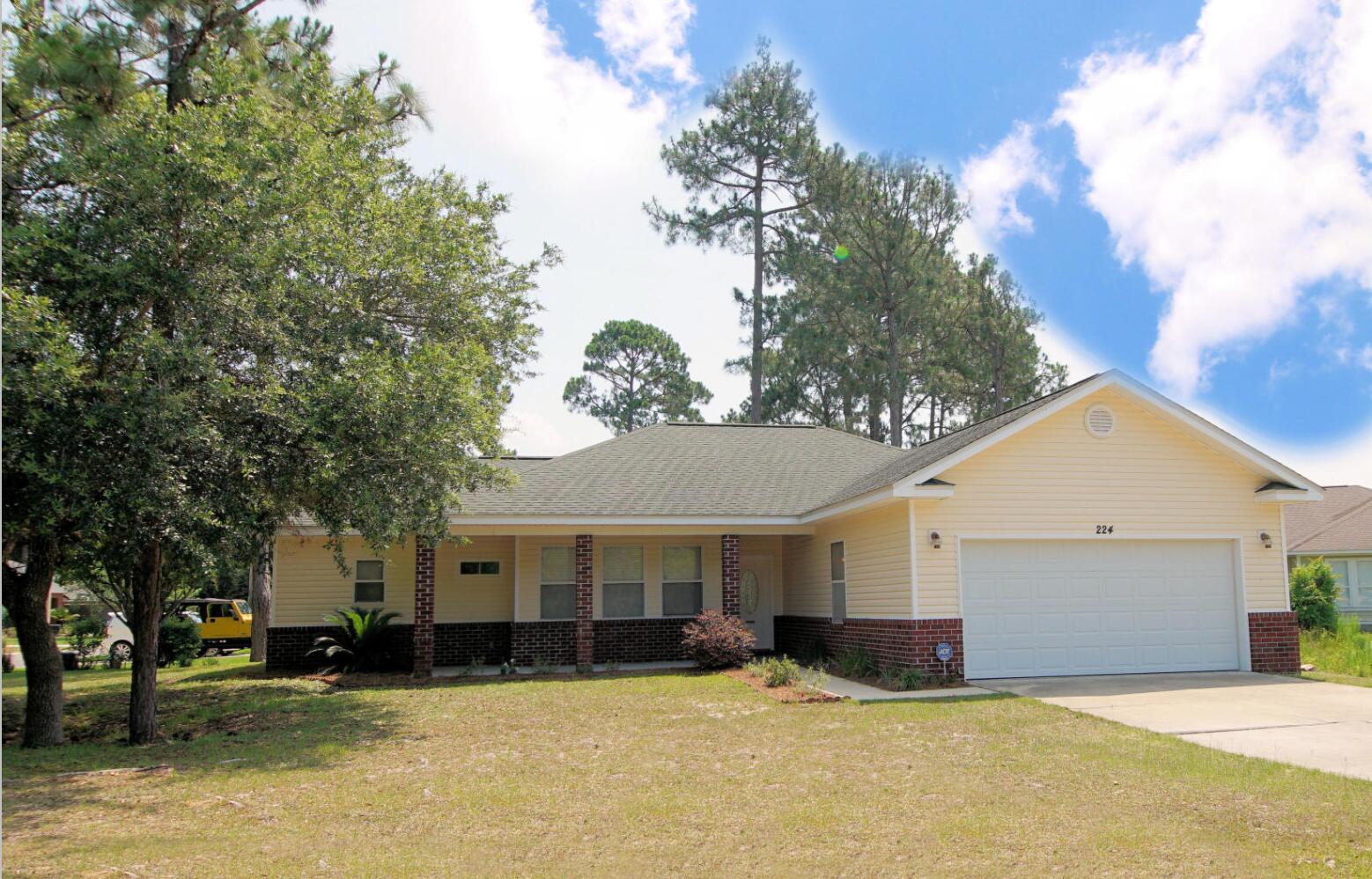 Welcome to your new home in this Desirable Santa Rosa Beach Neighborhood! Relax on the spacious covered front porch which features a pecky cypress ceiling overlooking the lake that creates a peaceful place to enjoy the outdoors. Enter the front door to an Open Floor Plan with 9ft ceilings and wood flooring. The open concept of the living, dining and kitchen provides an airy feel. Split floor plan offers master bedroom privacy. The master bathroom has a double vanity with separate shower and tub. Extra insulation included in the interior walls to reduce noise travel. Oversized garage with service door. BBQ patio with fenced in backyard and No HOA! Currently rented, however, the current tenants take care of it like it was their own. Buyer to verify all measurements and specifications.