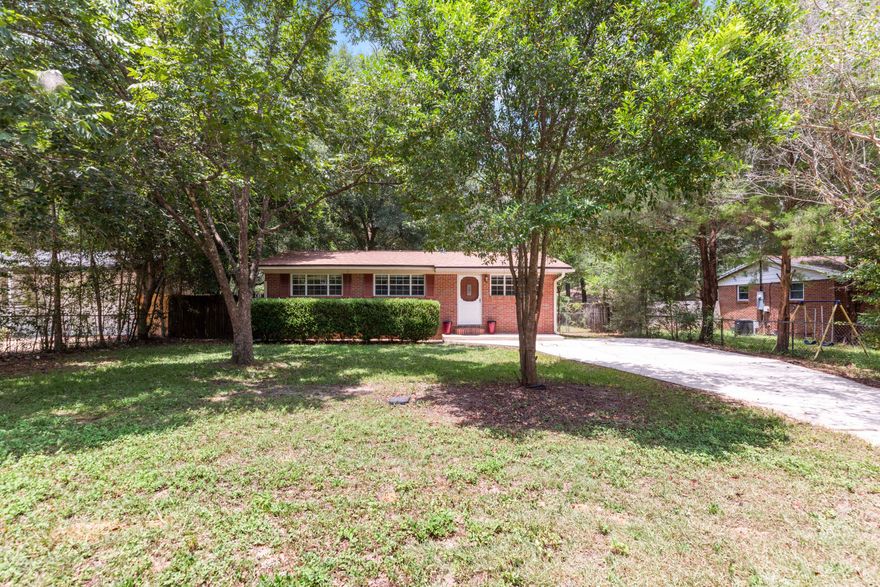 PERFECT HOME for the FIRST TIME HOME BUYER or INVESTOR! All brick 3 bedroom 1.5 bathroom home located in South Crestview! This 3/1.5 bath home has the original hardwood floors throughout the living room, hallway, and all bedrooms. Tile flooring can be found in all wet areas (no carpet)! As you enter the home, you are greeted by the living room with a coat closet to your left. Connected to the living room, you will find the dining area with ceiling fan and sliding glass door to the backyard and deck. Next to the dining area, the kitchen with plenty of cabinet and counter top space, refrigerator, stove, dishwasher, and disposal. Just off the living room, the long hallway will take you to the full bathroom on the right as well as the master bedroom on with it's own half bathroom. Bedrooms 2 & 3 are located on the left side of the hallway. The laundry room can be found behind the kitchen just off the deck. This property offers a spacious front and back yard with ample room for parking. The backyard has a beautiful deck that overlooks the fully fenced backyard. There is also a large workshop with a cover patio lean-off that coveys with the property AS-IS. The home has 2 year old ROOF and a 3 year old HVAC! This home is located with-in walking distance to Twin Hills Park and the lake with walking paths. Don't miss out on your opportunity for affordable living in Crestview, schedule your showing today!