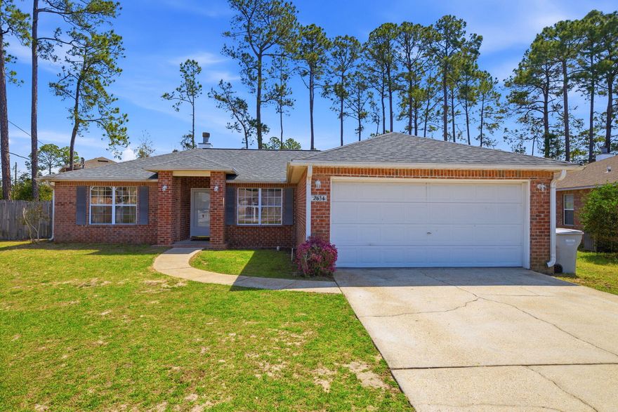 Welcome to this well maintained 3 bedroom, 2 bathroom, brick home in Navarre's Hidden Estates neighborhood. Located just minutes from the Hidden Creek Golf Course and the sugary white sands of Navarre Beach. Offering peace of mind with a 2022 Roof, 2024 HVAC system, 2024 Water Heater, fabric hurricane shutters, and a hurricane rated garage door. The interior features a split floor plan with fresh paint throughout, vaulted ceiling in the living room with a cozy fireplace, and plush new carpeting in the living space and bedrooms. The kitchen is equipped with solid oak cabinets, tiled flooring, a breakfast bar, and a dining nook with a beautiful bay window to let in natural lighting and to catch a view of the large, fully fenced-in backyard. The primary bedroom is just off the kitchen and has its own incredible ensuite bathroom with double vanity, walk-in shower, separate soaking tub, and double walk-in closets. The additional bedrooms and bathroom are on the opposite side of the home for added privacy. Schedule your showing today and make this your home on the Emerald Coast!