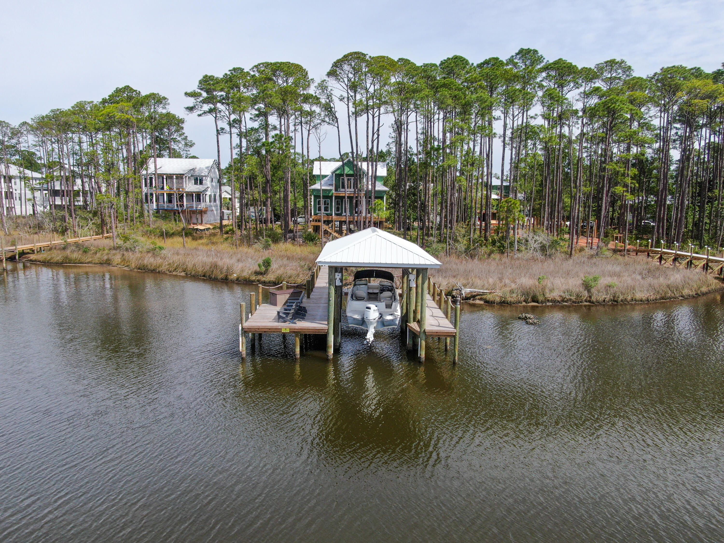 Looking for your next investment opportunity? Look no further than this stunning partially constructed home available for sale As-Is. Located on a breathtaking waterfront lot on Hogtown Bayou in the sought after gated community of Cessna Landing. Home neighbors newly constructed multi-million dollar architectural beauties. This property boasts all the features you need to create your dream home. Newly finished dock/boat lift which enables you to enjoy the waterfront lifestyle right away. This elite neighborhood enclave offers ideal privacy, a community pool perfect for relaxing with friends and family on those hot summer days. Nestled within 1/3 wooded acre located minutes to the beach & all that 30A has to offer.Don't miss out on this incredible investment opportunity to make your own.