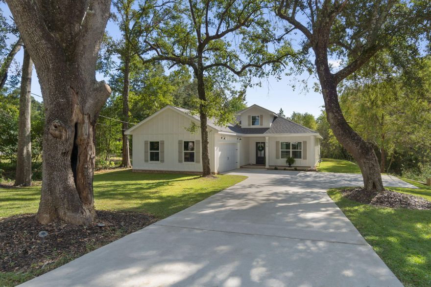 Situated on an oversized lot just under 3/4 of an acre, this brand-new, semi-custom Craftsman-inspired home offers the perfect blend of timeless design and modern luxury. With nearly 2,000 square feet of thoughtfully designed living space, this 4-bedroom, 2.5-bathroom residence provides room to grow, entertain, and enjoy everyday comfort. From the moment you step inside, you'll notice the custom cypress wood beams and soaring vaulted ceilings that create warmth and character throughout. The chef-inspired kitchen is both stylish and functional, featuring tall cabinets, a gas range, and a tankless hot water heater--ensuring endless convenience for the busy modern lifestyle. Your primary suite is designed as a private retreat, complete with a free-standing soaking tub and a beautifully tiled shower, offering a spa-like experience right at home. With the added benefit of a tankless water system, you'll never have to worry about running out of hot water. What truly sets this property apart is the opportunity to make it your own. Choose from a wide variety of flooring options, quartz colors, and cabinet finishes to customize your home to match your style something you won't find in most builder-grade homes. This home is brought to you by a family-owned builder that takes pride in crafting homes with heart. With a focus on quality, integrity, and personalized service, they ensure every detail reflects a commitment to excellence. Bonus: You can even tour this same floor plan in another neighborhood to see the design come to life before making it yours. (Please note: Photos shown are stock images from similar homes actual finishes will vary based on your selections.) Don't miss your chance to own a semi-custom home on a rare, oversized lot in the fast-growing Cantonment area. This is more than just a house it's a place to create memories for years to come. Estimated completion time is the end of February, 2026.