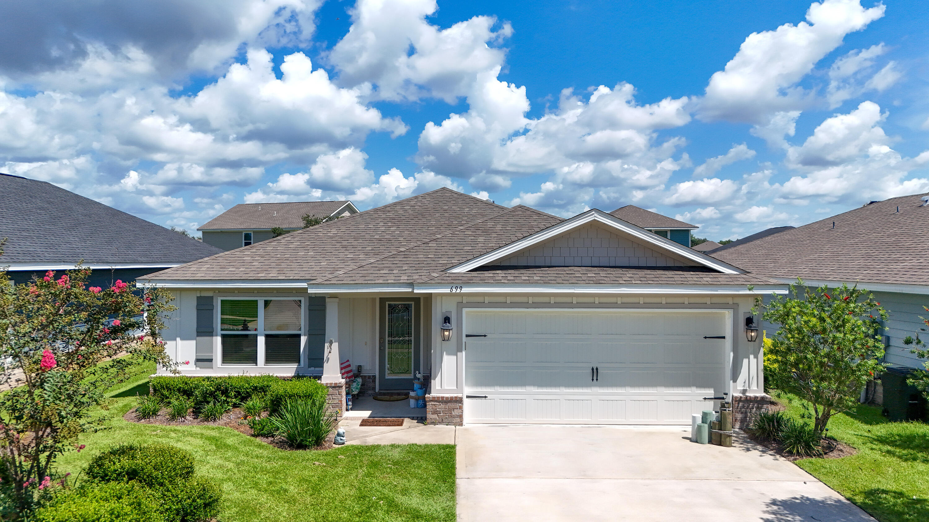 Discover modern elegance in the desirable Riverwalk subdivision of Freeport. Built in 2021, this 3-bedroom, 2-bath home with a flex room offers 1,768 sq ft of thoughtfully designed living space and a spacious 2-car garage. The versatile flex room can serve as a den, office, or additional bedroom, adapting to your needs. Step inside to an open-concept layout where the living, dining, and kitchen areas flow seamlessly perfect for entertaining or everyday comfort. The gourmet kitchen features premium finishes, ample cabinetry, and a large center island that serves as the heart of the home. The private owner's suite offers a serene retreat with a walk-in closet and ensuite bath complete with double vanities. Two additional bedrooms and a guest bath are situated for comfort and privacy. A dedicated laundry room provides direct garage access. Enjoy outdoor living on the covered patio overlooking the backyard. Riverwalk residents enjoy exceptional amenities including a community pool, dock, fitness center, and a community room. Ideally located just 15 minutes from the white-sand beaches of 30A and 5 minutes from shopping and dining, this home offers the perfect balance of coastal living and everyday convenience. Welcome to Riverwalk, where style, comfort, and location come together.